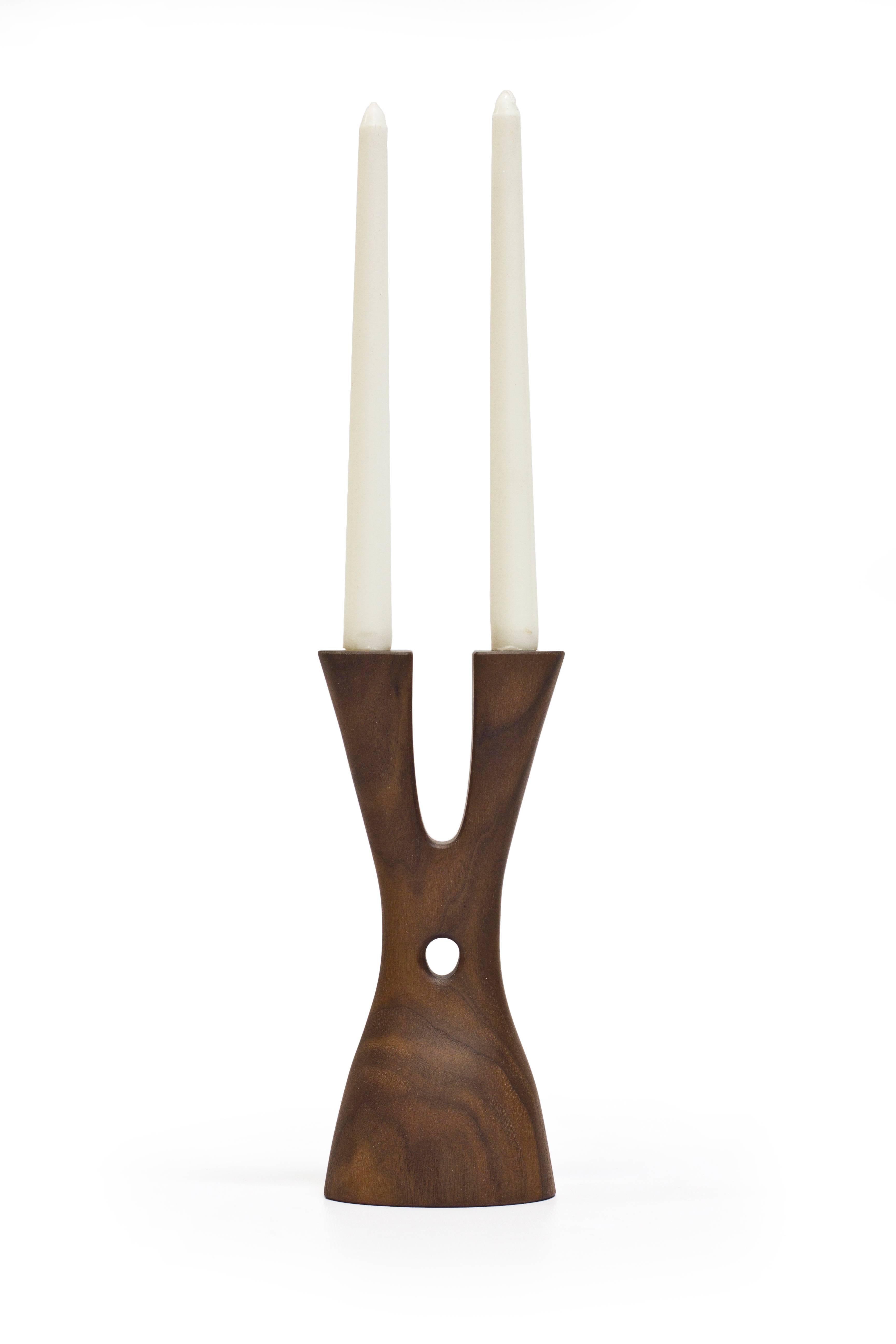 The Mastodon by Noah Norton for Wooda powerfully lifts and holds two tapers. Inspired by the natural world and crafted in beautiful walnut, ash, and oak, Mastodon is designed to brighten a room and encourage conversation.

About the designer: Noah