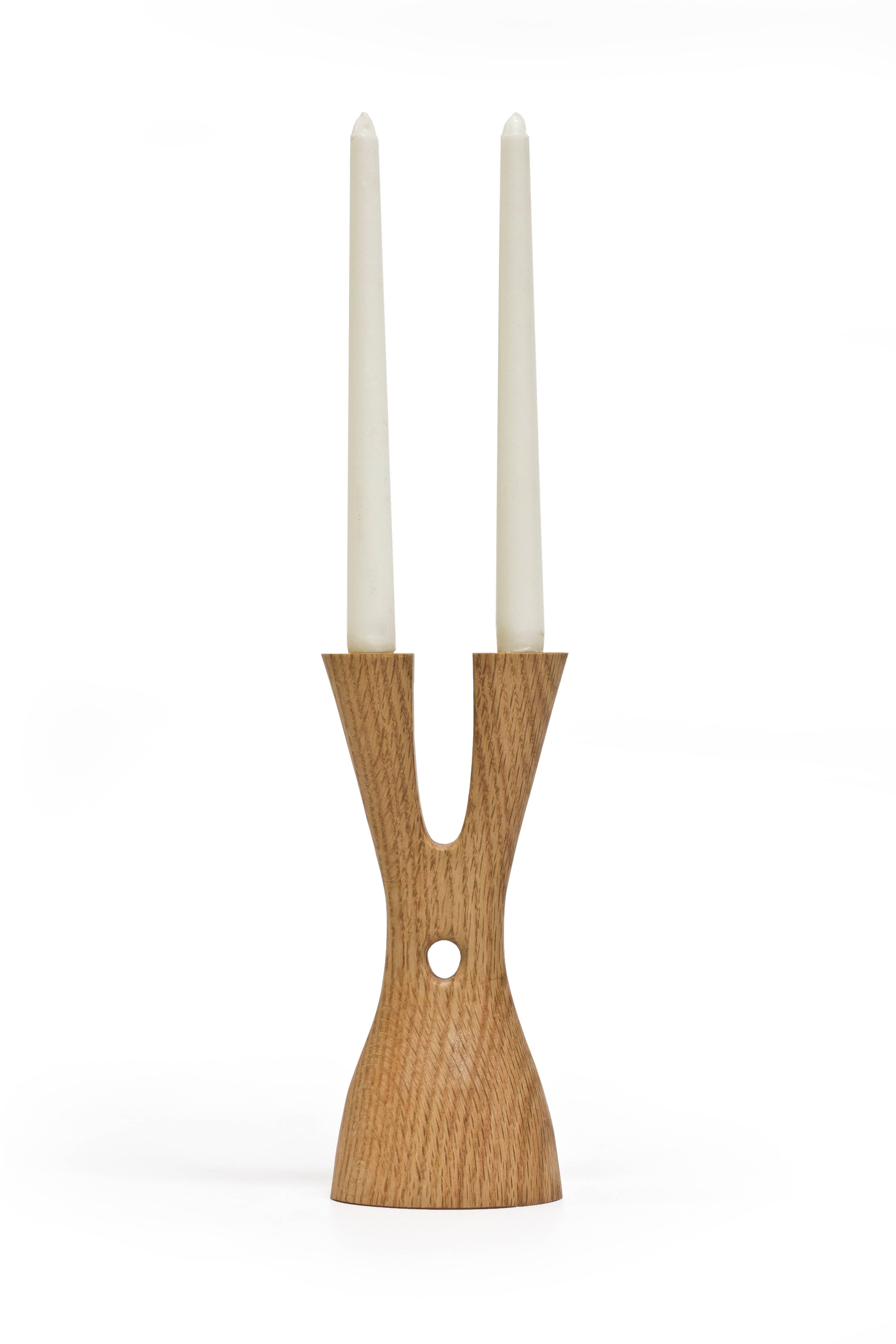 The Mastodon by Noah Norton for Wooda powerfully lifts and holds two tapers. Inspired by the natural world and crafted in beautiful walnut, ash, and oak, Mastodon is designed to brighten a room and encourage conversation.

About the designer: Noah
