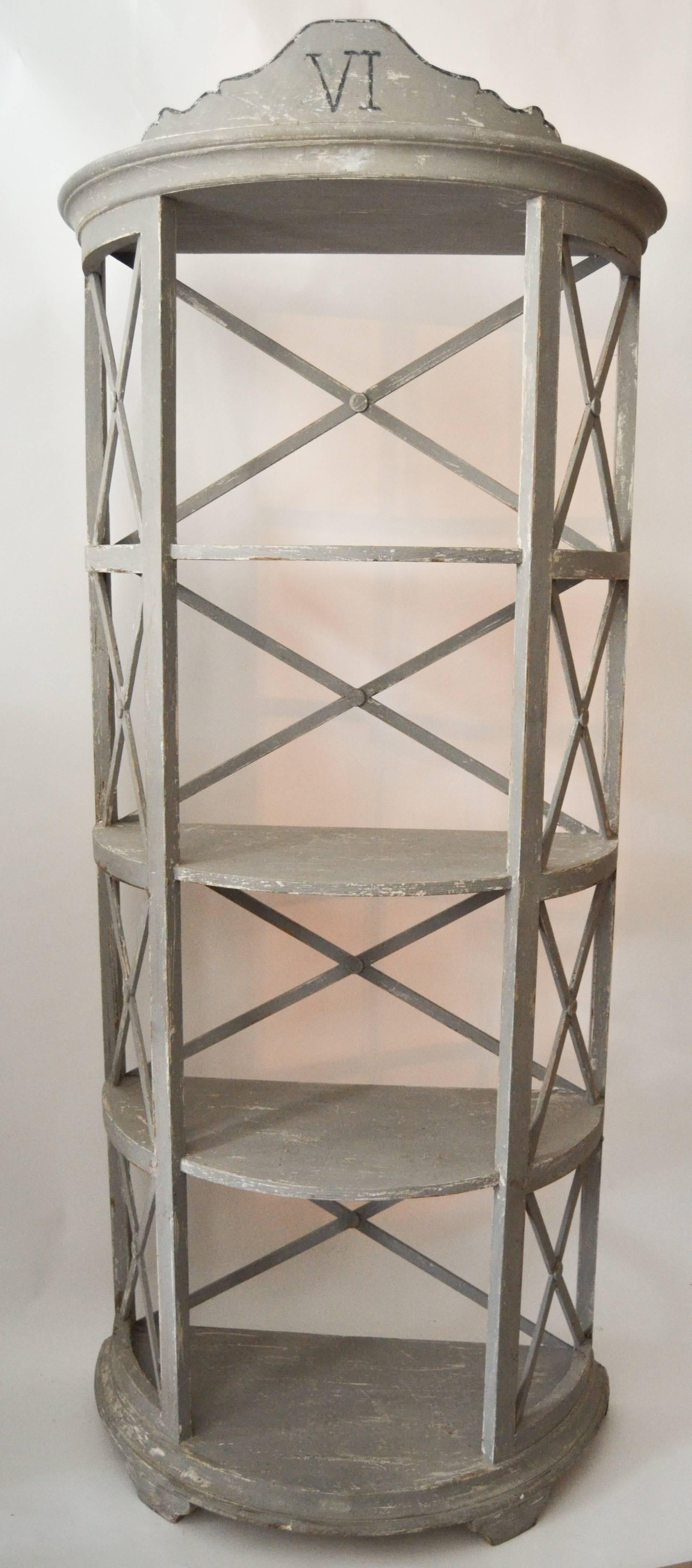 Pair of florentine demilune etagere painted in grey with multiple paint histories. Styled as old apothecary shelves each having four shelves with neoclassical and Victorian influences.