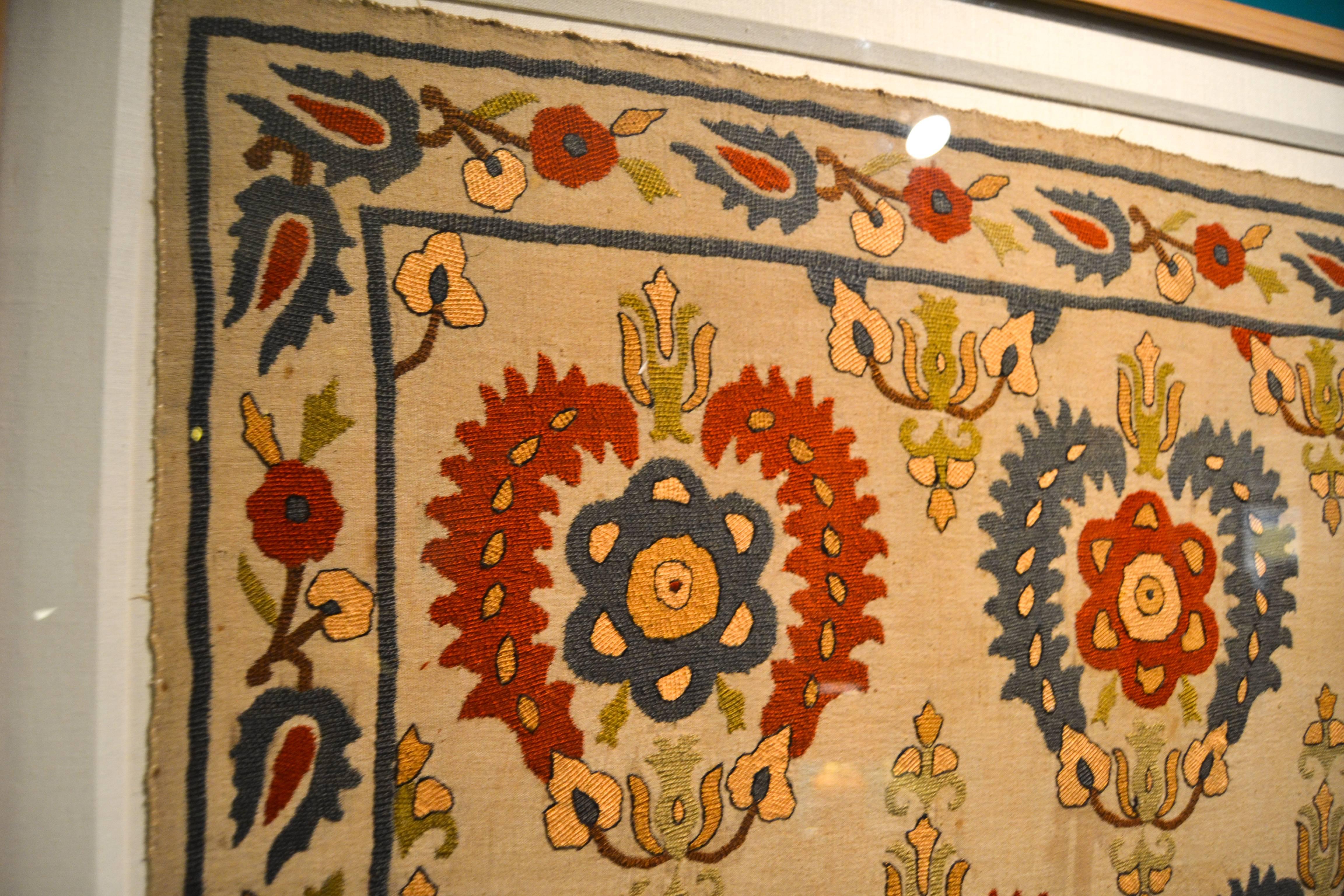early 19th century embroidered Ottoman Bursa textile deaccessioned from a New York life insurance company's collection. Professionally mounted and framed in plexiglass. Areas of discoloration and one nickel sized hole in bottom half. Moderate