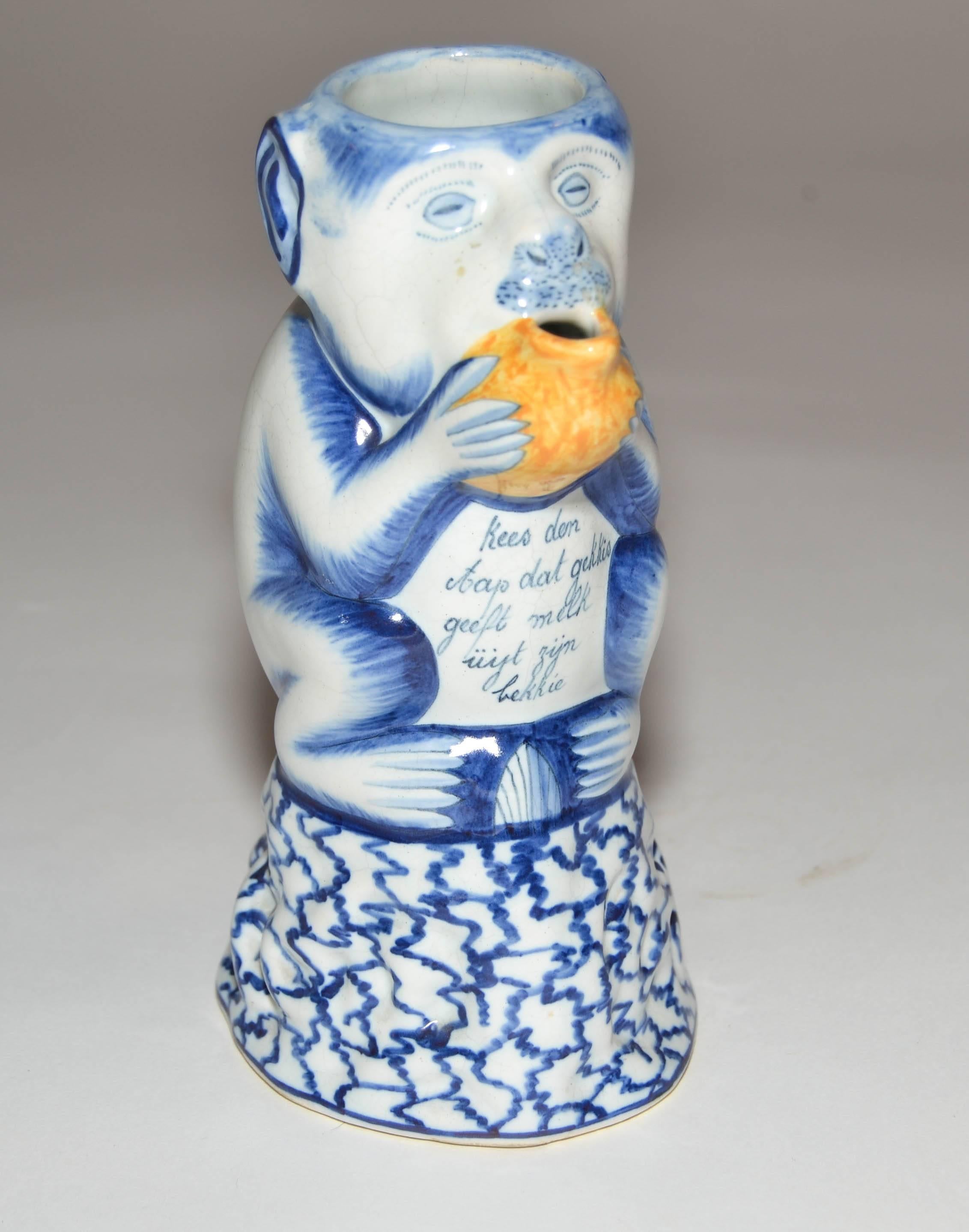 19th century delft ceramic monkey milk pitcher. A similar form is on Aronson's website wearing a yellow beanie. A perennial favourite, the monkey pitcher is inscribed to delight the viewer with a saying analogous to the monkey 