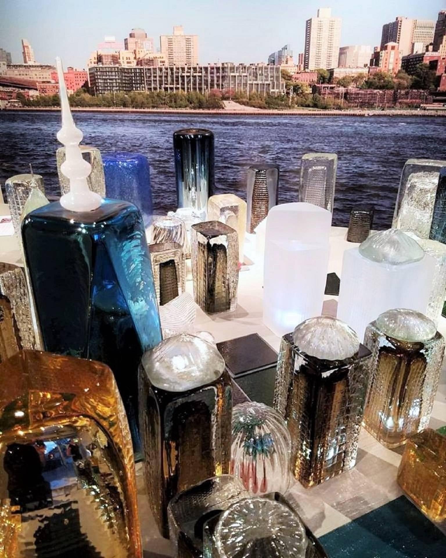 Handmade custom skyline of lower Manhattan composed of blown and hot sculpted glass objects. Grouping consists of 50 various pieces to compose the skyline as shown, along with a portrait of the Brooklyn waterfront to serve as a backdrop.