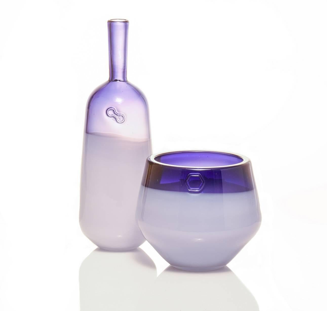 The Branded series is a set of modern design objects which each feature a hand impressed brand that highlights these wholly handmade vessels. For color, each piece features a transparent tone on the entire piece with an opal white overlay on the