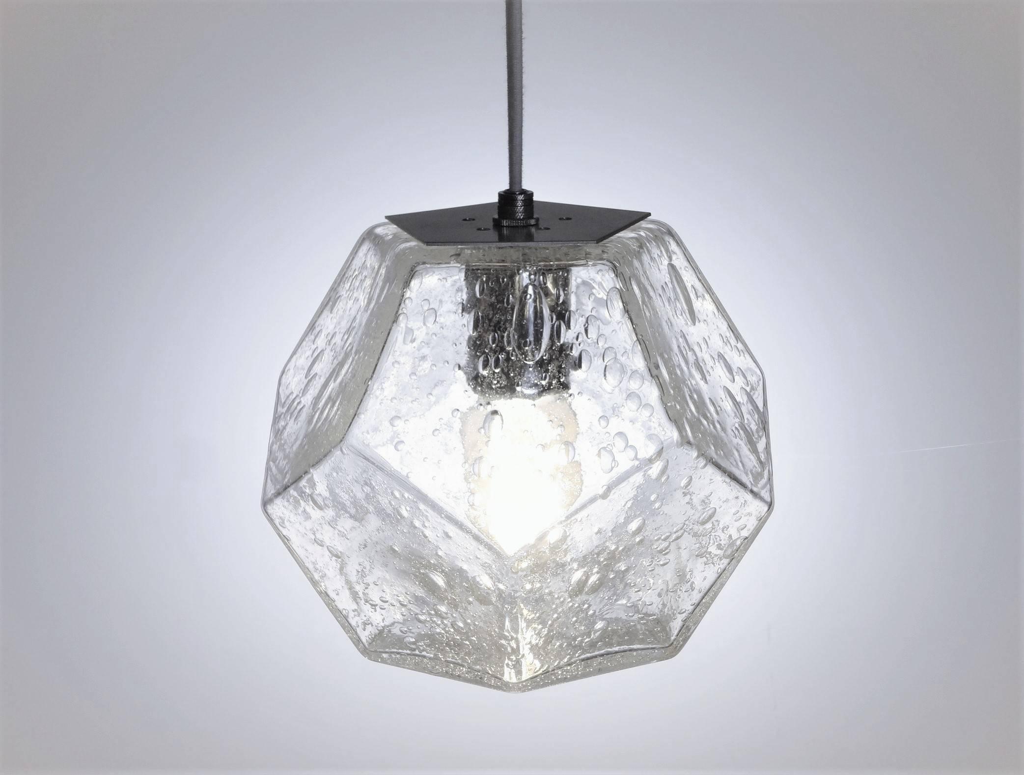 These hanging lights feature an faceted machine-made quality to offset these otherwise wholly handmade creations. Whether showcased individually, as an aligned set or a geometric cluster, these designs create a lustrous array of luminance