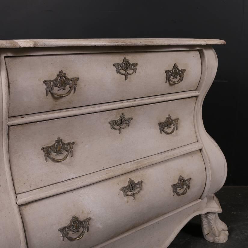 18th century painted Dutch bombe three-drawer commode, 1780

The dimensions of the top are:

36 inch (91cm) wide 
18.5 inch (47cm) deep

  
Dimensions:
40 inches (102 cms) wide
19.5 inches (50 cms) deep
29.5 inches (75 cms) high.
 