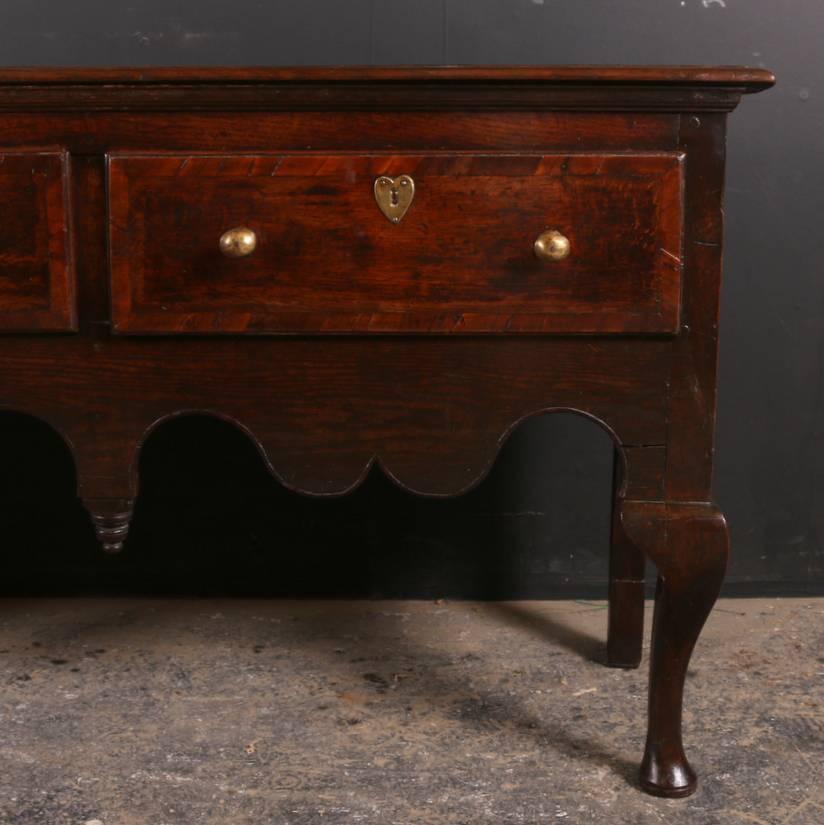 Large 18th century oak dresser base on cabriole legs, 1760. 

Dimensions
77 inches (196 cms) wide
17 inches (43 cms) deep
31 inches (79 cms) high.

            