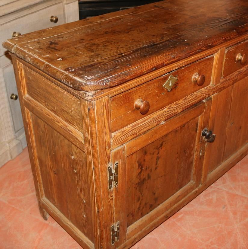 18th century antique English pine dresser base, 1760

  

Dimensions 
75 inches (191 cms) wide
20 inches (51 cms) deep
34 inches (86 cms) high.

 