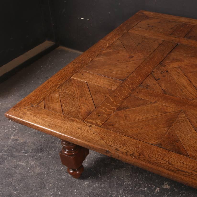 Huge 19th century English oak low table with an unusual parquetry top, 1890.

Dimensions
64.5 inches (164 cms) wide
50 inches (127 cms) deep 
19 inches (48 cms) high.

              