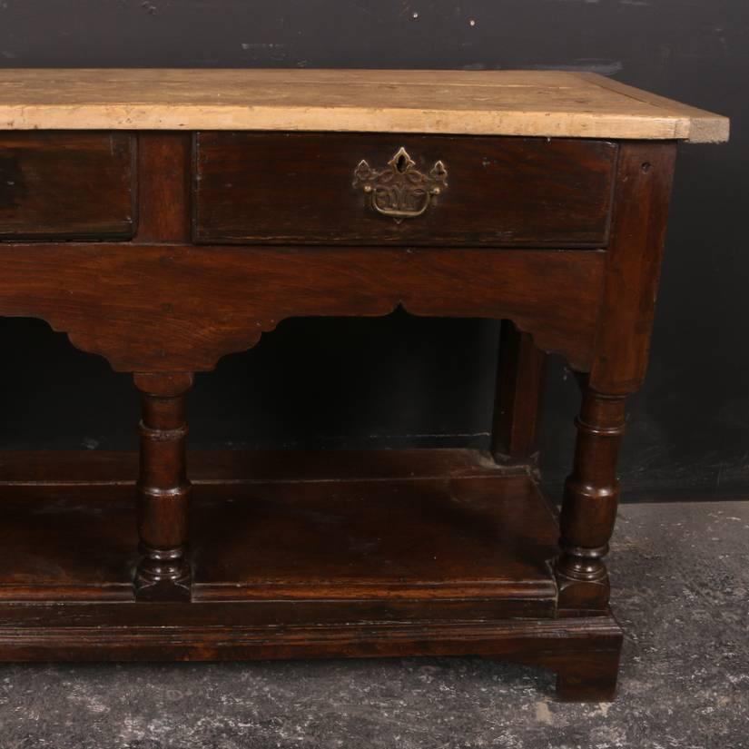 18th century English oak and sycamore dresser base, 1780

Dimensions:
77 inches (196 cms) wide
18.5 inches (47 cms) deep
30.5 inches (77 cms) high.

 