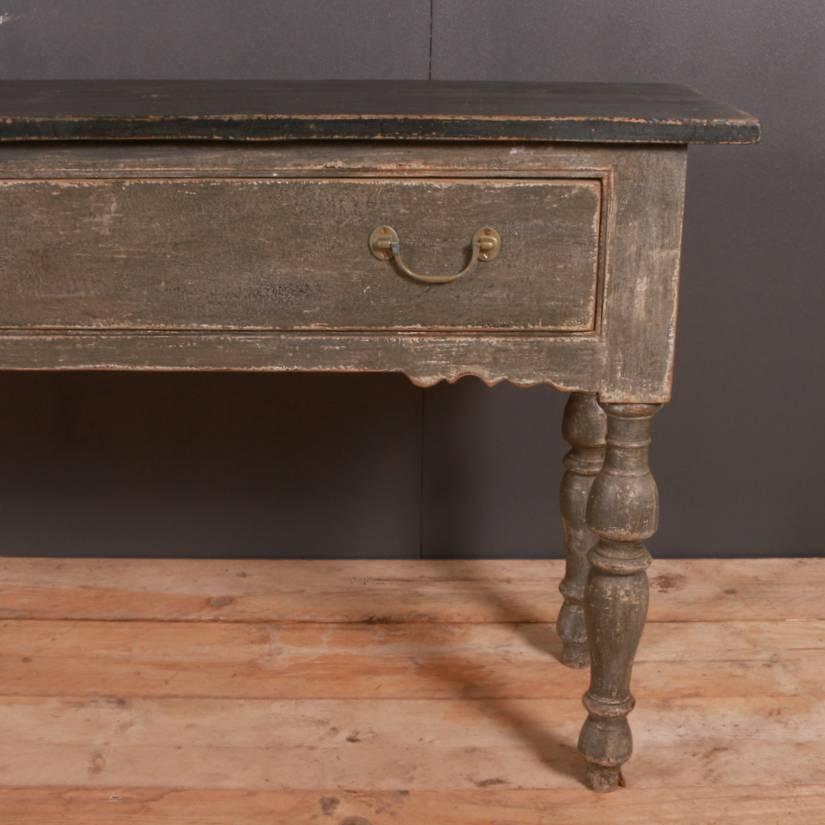 Large antique painted pine two-drawer serving table, 1830.

Dimensions
90 inches (229 cms) wide
16.5 inches (42 cms) deep
32 inches (81 cms) high.

         
