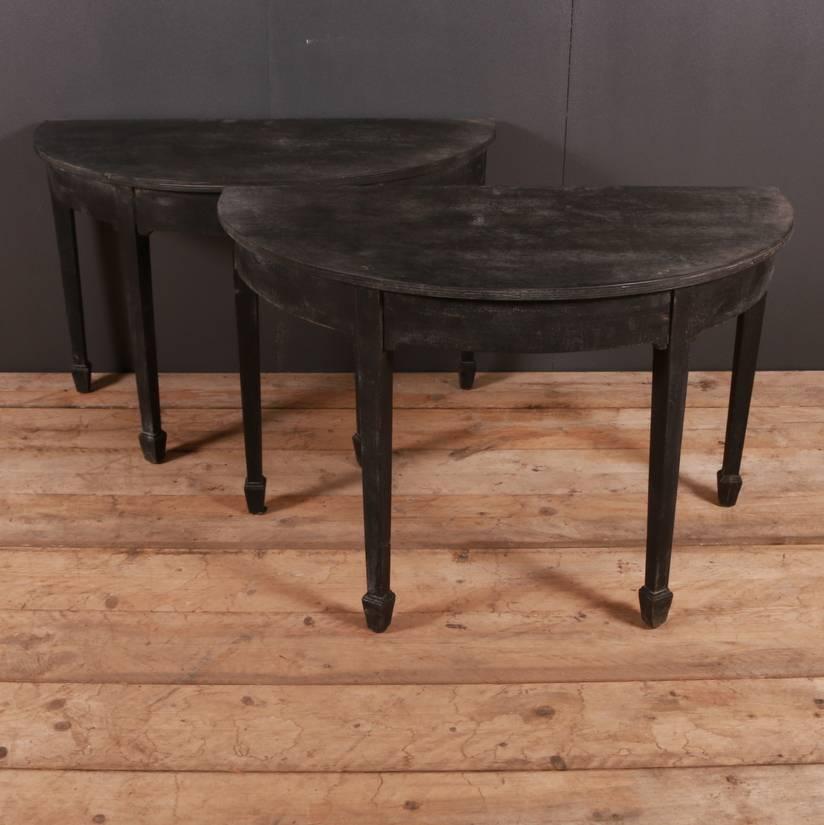 Pair of early 19th century English painted demilune console tables, 1820.

Dimensions
44.5 inches (113 cms) wide
24 inches (61 cms) deep
28 inches (71 cms) high.

          