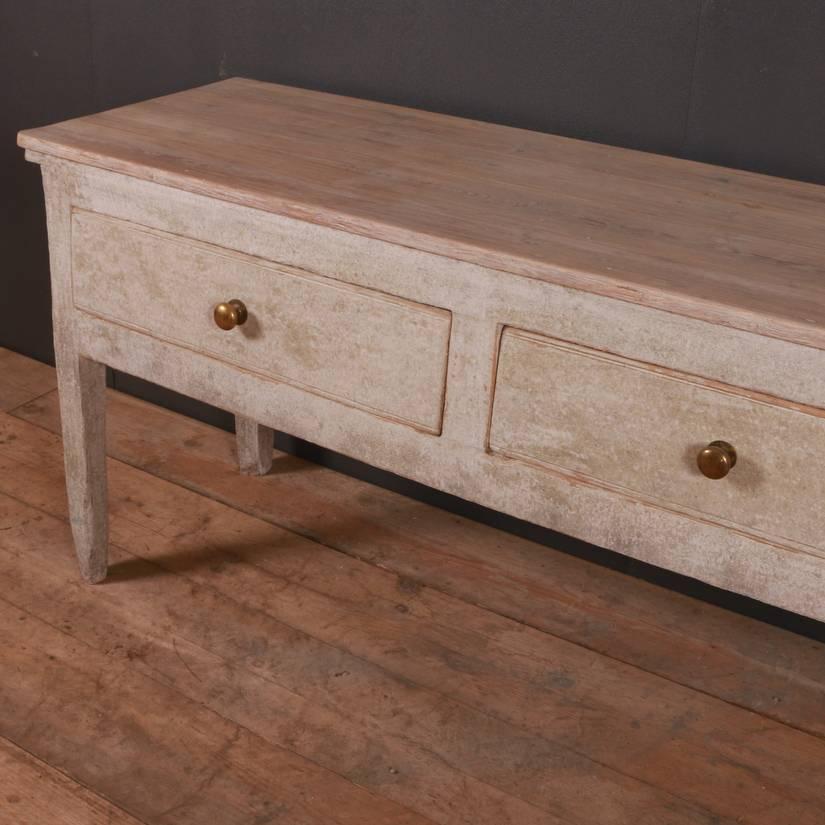 Good early 19th century painted three-drawer dresser base, 1820

Dimensions
85.5 inches (217 cms) wide
20.5 inches (52 cms) deep
30 inches (76 cms) high.

 