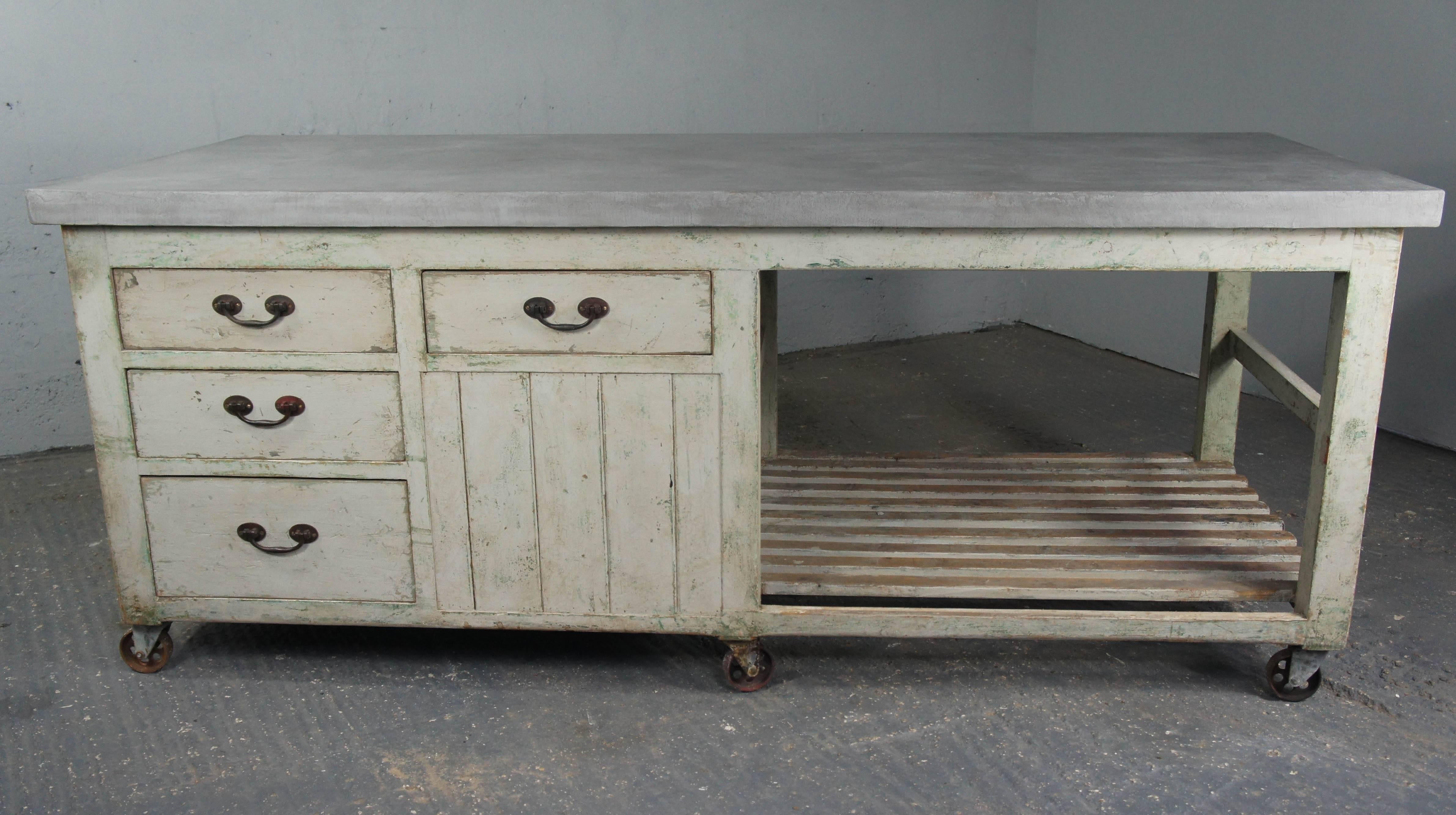 Fantastic Industrial pine workbench with modern cement resin top. Cement resin is extremely durable and practical for use in a kitchen. Later pale grey paint with hints of green showing through where the top layer of paint has worn away. There are