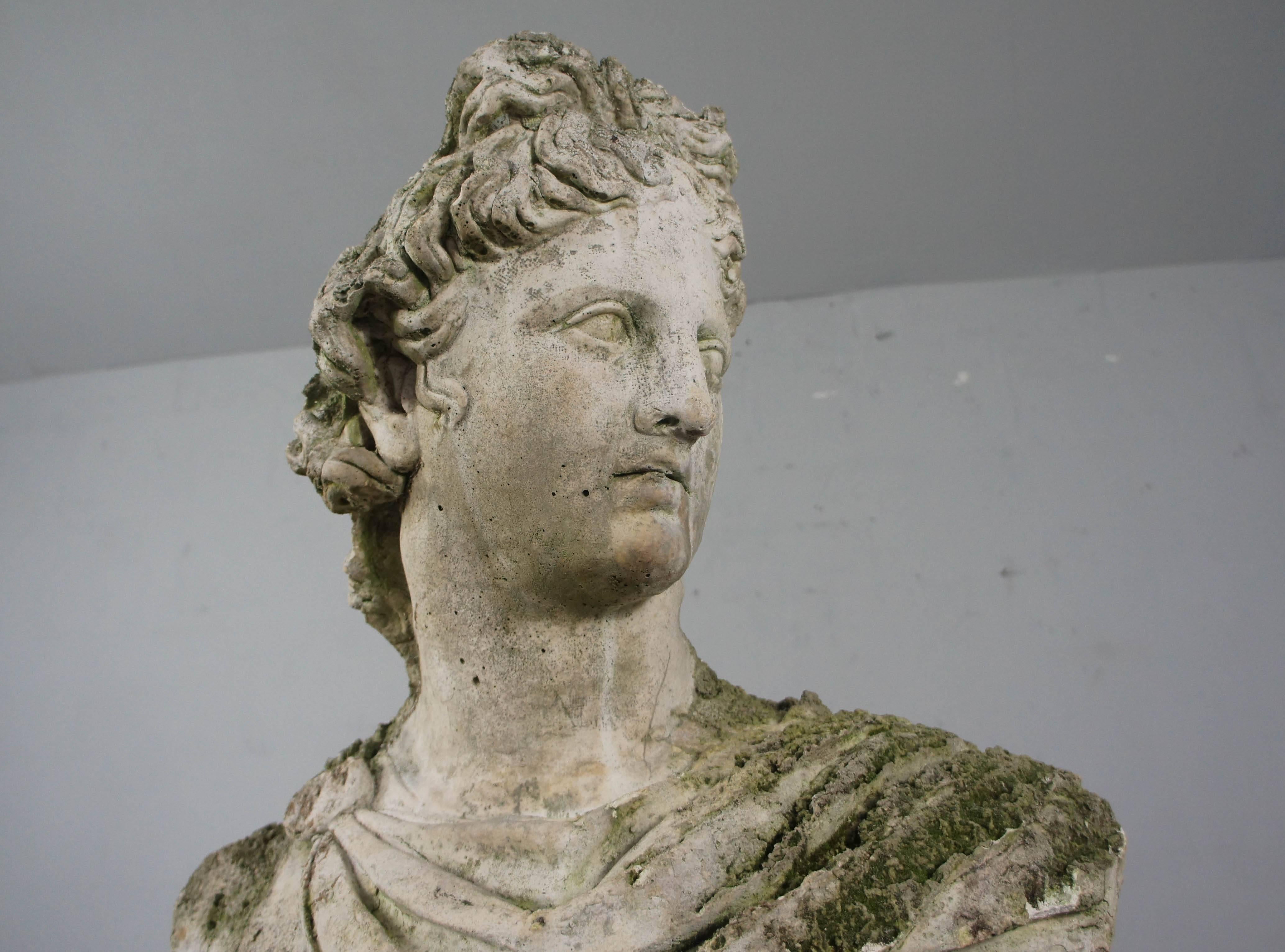 Beautifully weathered composite bust of Apollo. Great decorative garden item.