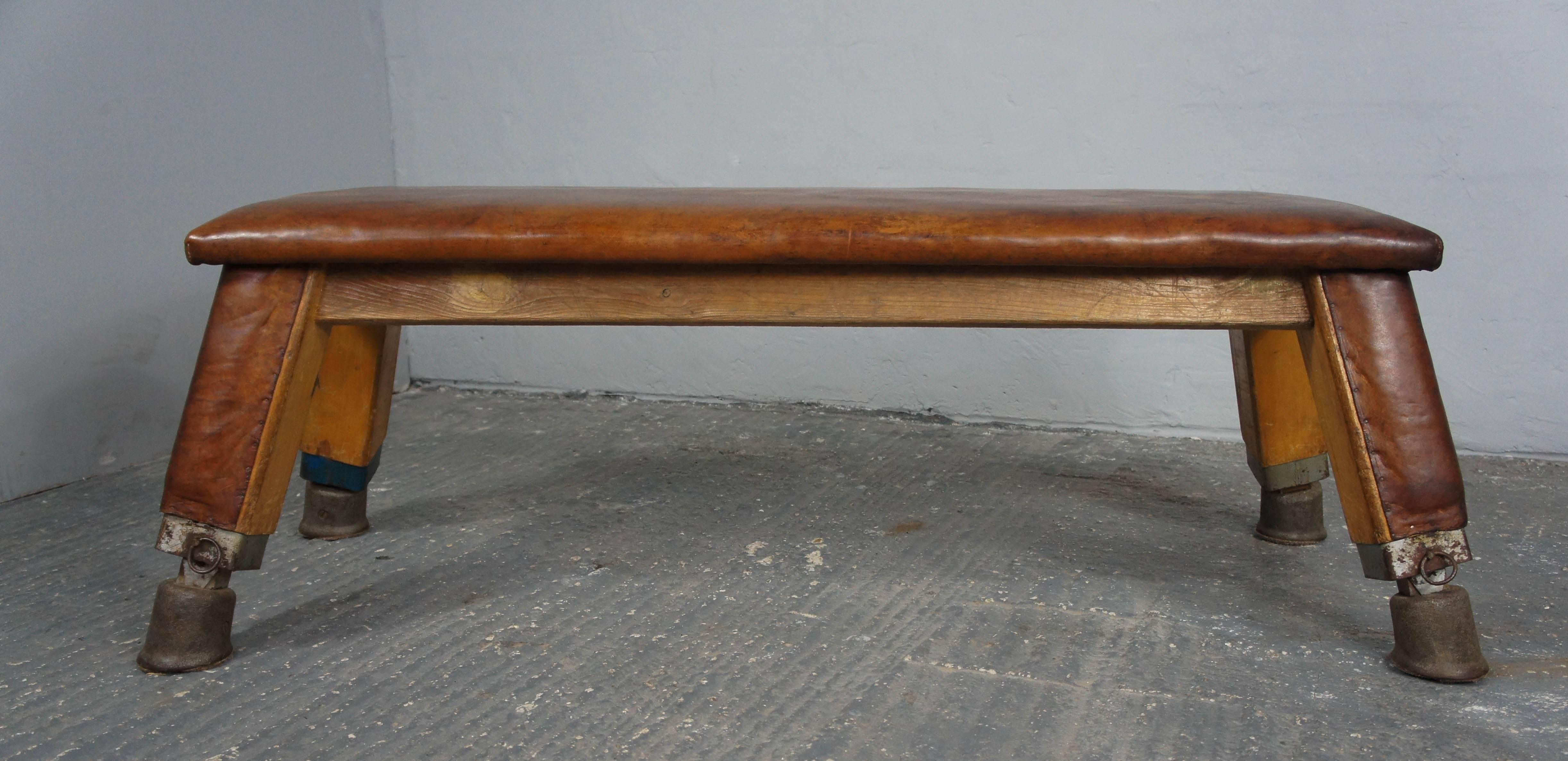 An original leather gym bench originating from the Czech Republic in the 1930s. It is in excellent condition with no rips or holes in the leather. Great as coffee tables.