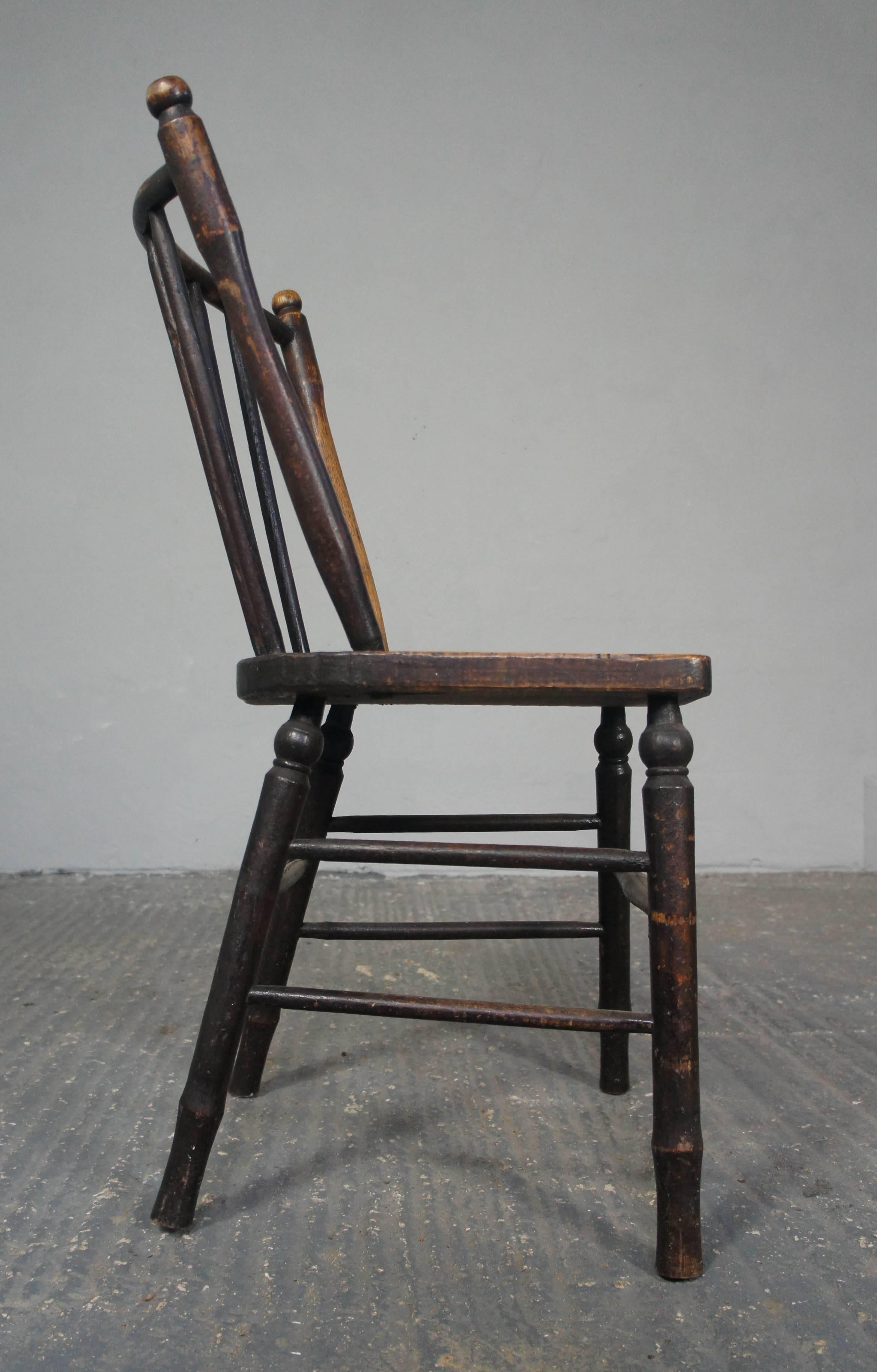 An early example of an Irish ash and elm kitchen chair. Simple, rustic design.