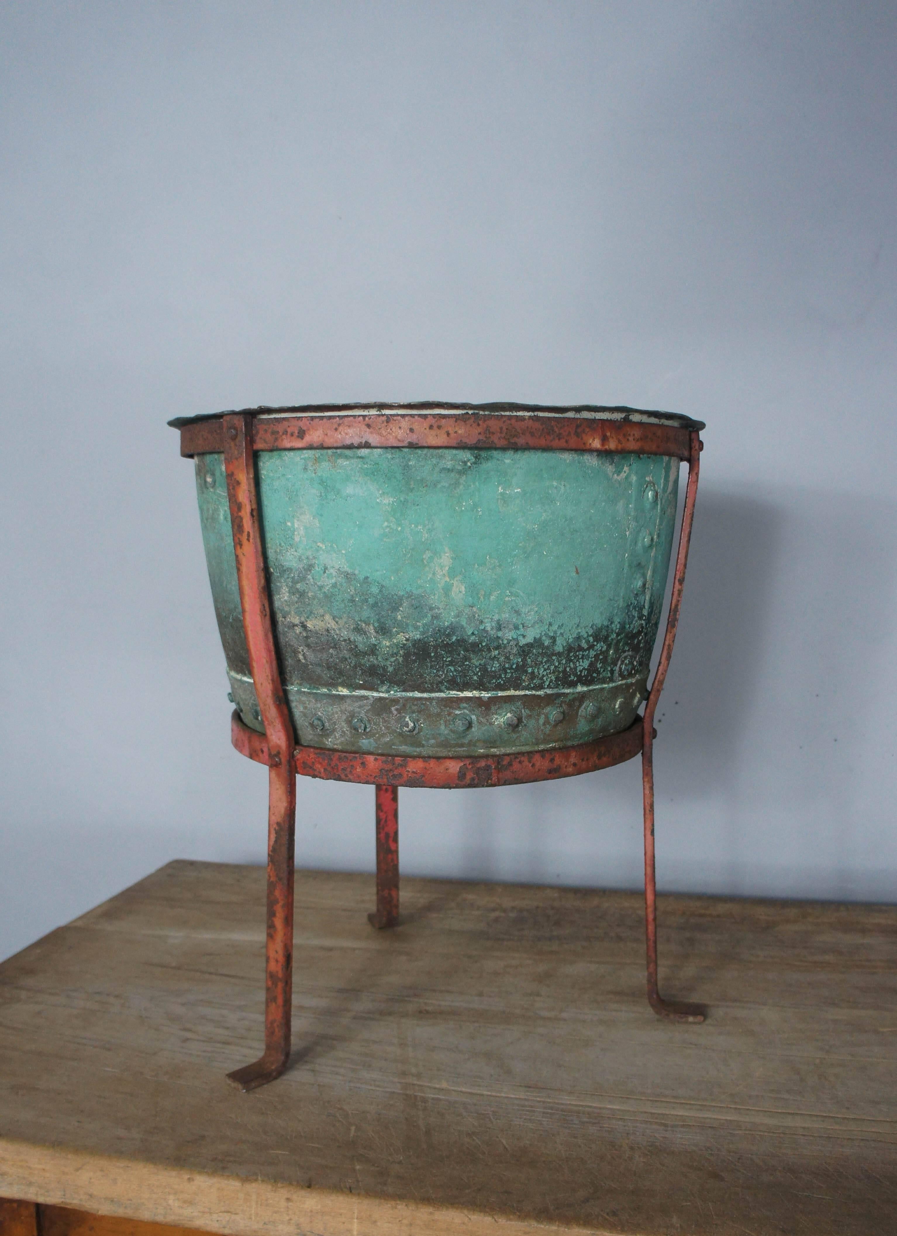 Beautiful verdigris copper riveted planter on original stand. Can be used with or without stand.