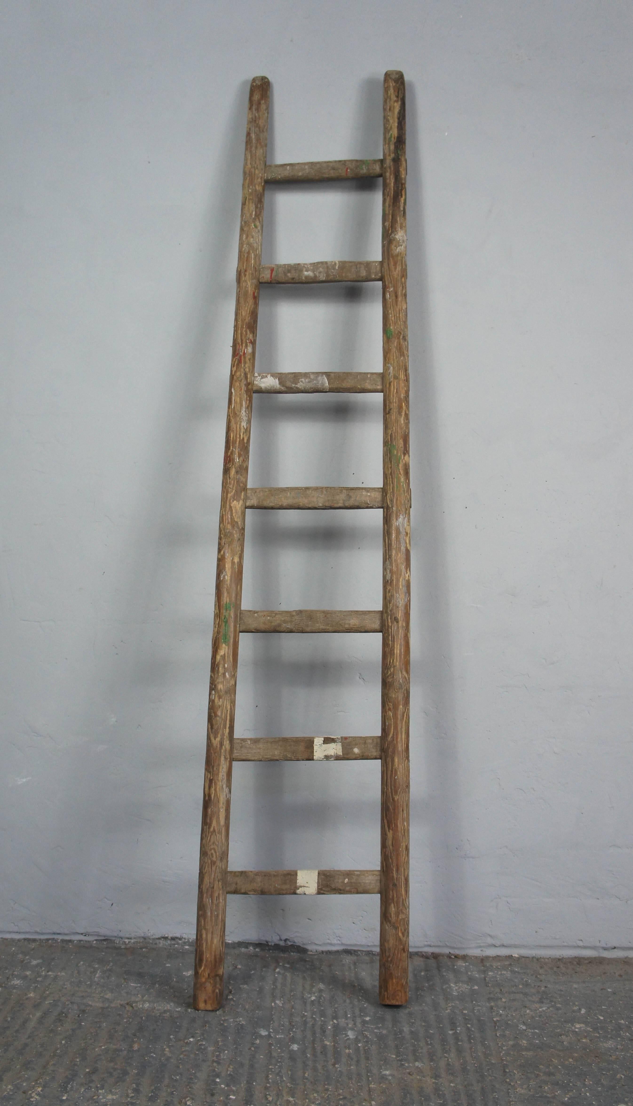 Rustic wooden ladder, perfect for hanging towels on in the bathroom.