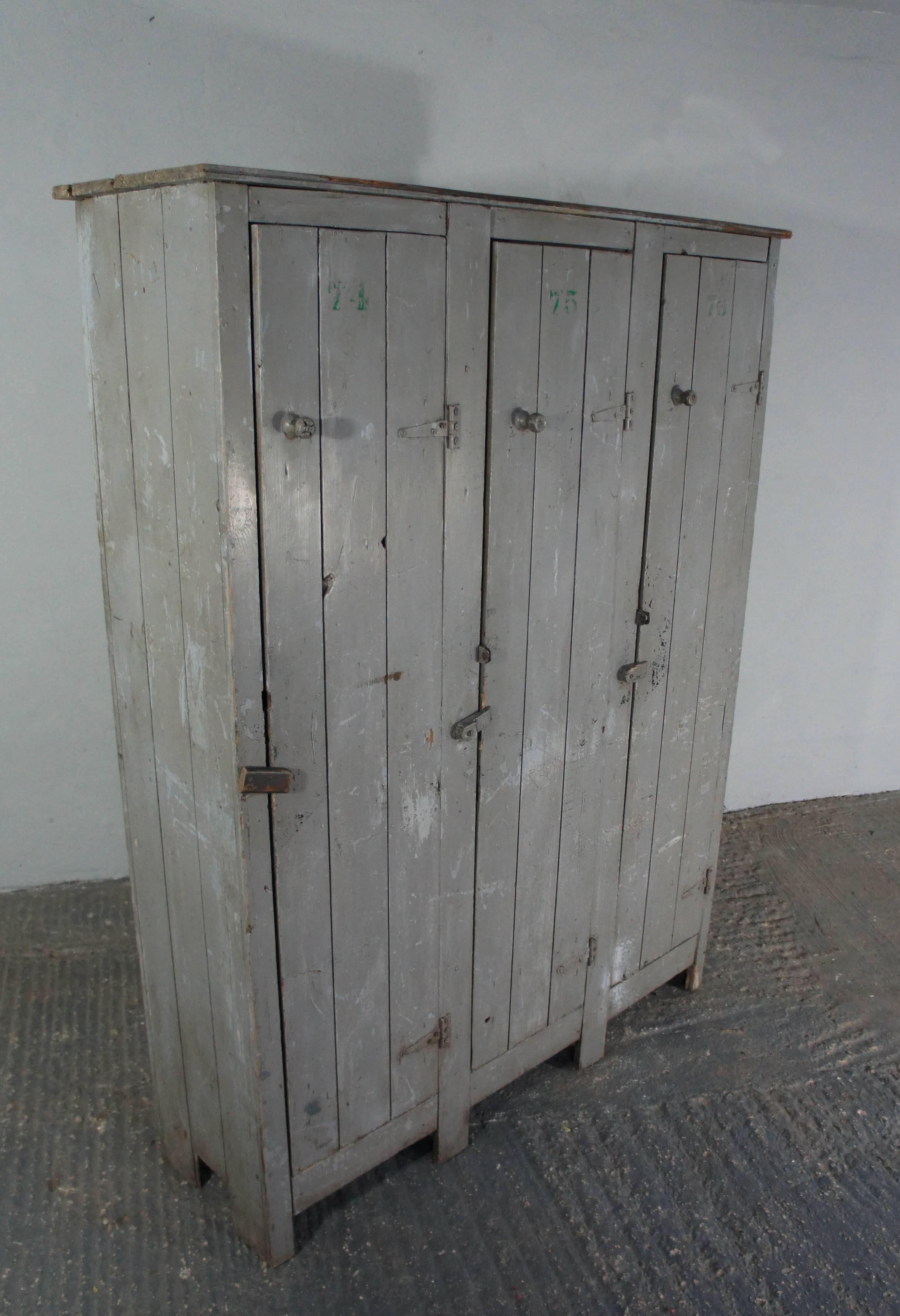 Great looking lockers in original pale grey paint. Great storage in three compartments which are divided into shelves inside. Each door has a number stencil. Clean and ready to use.