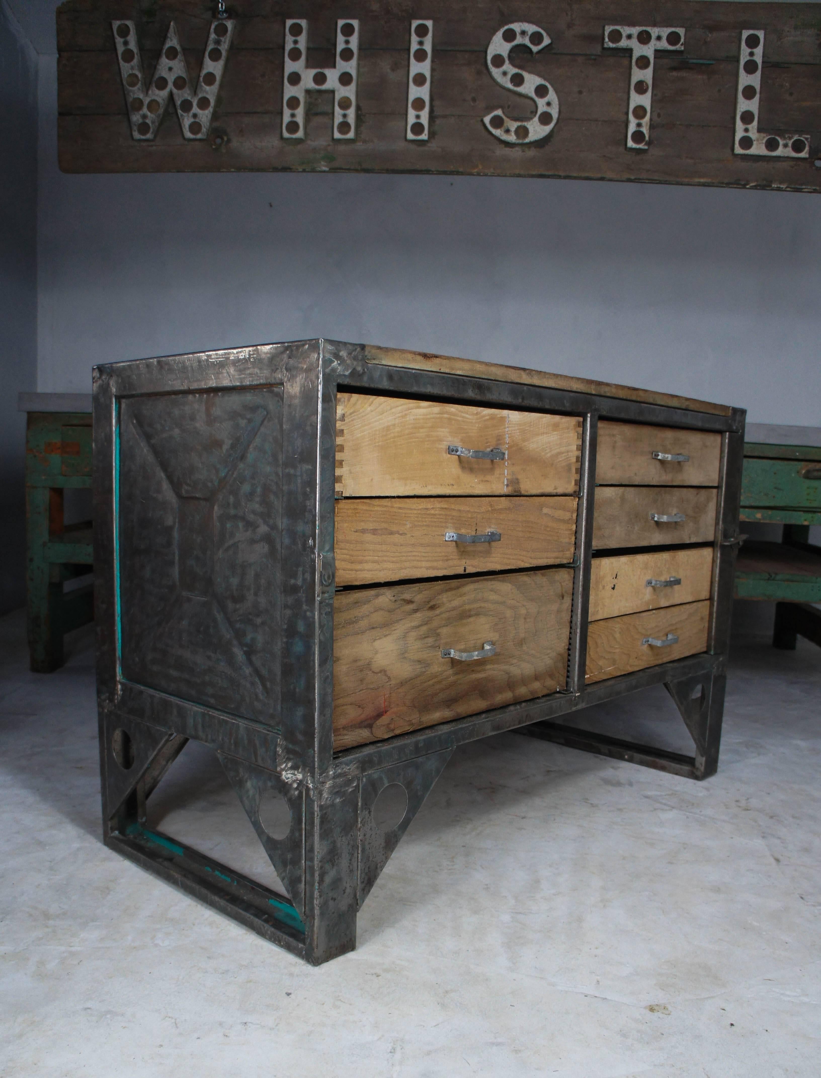 Sourced from a former aeroplane factory in the Czech Republic, this Industrial workbench features a polished steel frame, hardwood top and lockable drawers to one side. Great vintage Industrial piece for shops, restaurants or the home as a kitchen