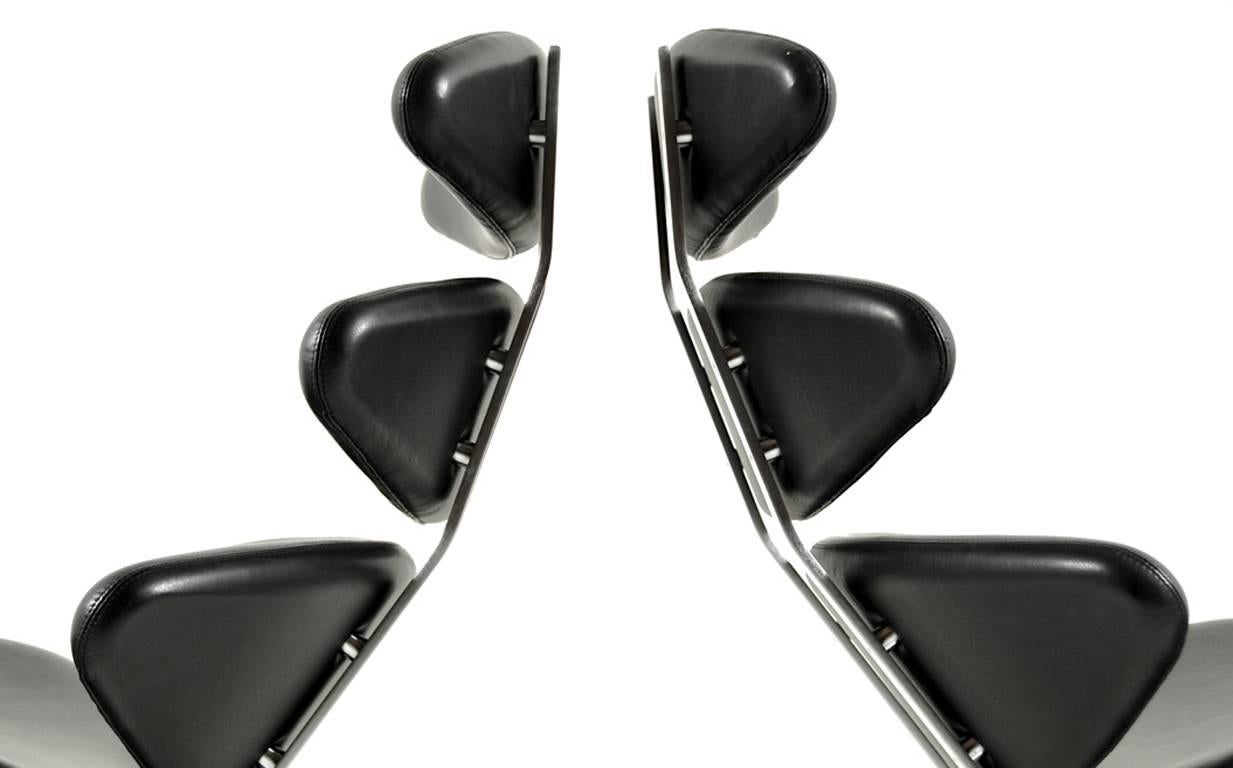 Pair of "Corona Chairs" by Poul M. Volther. Manufactured by Erik Jørgensen Møbelfabrik A/S in 2005. Model: EJ 5. Upholstery in original black Arne Sörensen leather. Base in steel. Designed in 1958.

Lit. '1000 Chairs' by Charlotte &