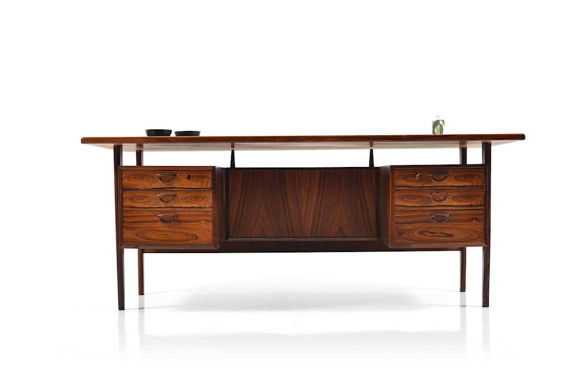 Mid-Century freestanding rosewood desk by Kai Kristiansen, Denmark. Model FM large version. Front with six drawers, backside divided with shelf and two closets. Designed in 1958, produced by Feldballes Furniture.