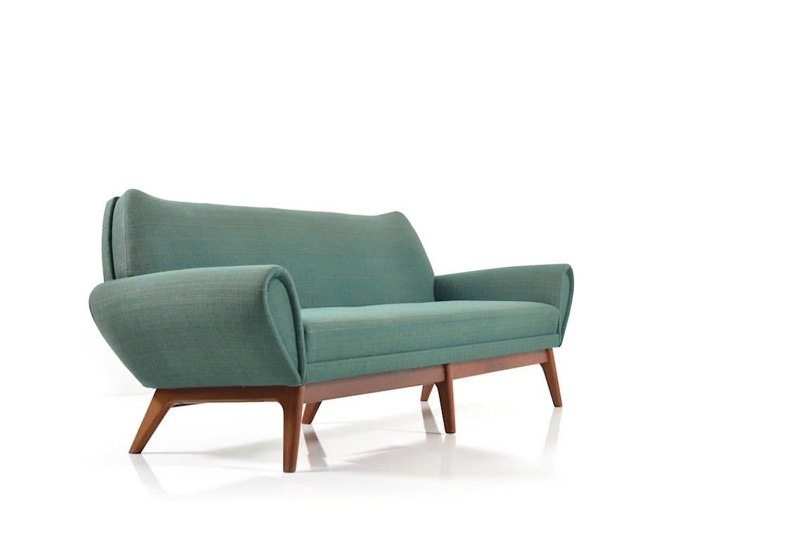 Three-seat sofa by Kurt Østervig. Upholstered with original wool in two shades of green. Six-legged teak base. 1960s production. Nice vintage condition.