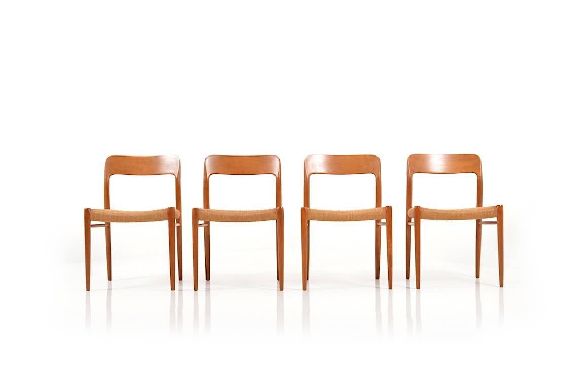 Set of four dining chairs in solid teak by Niels O. Møller. Model no.75. Seats in original papercord. Produced by J.L. Møllers Møbelfabrik, 1960s.