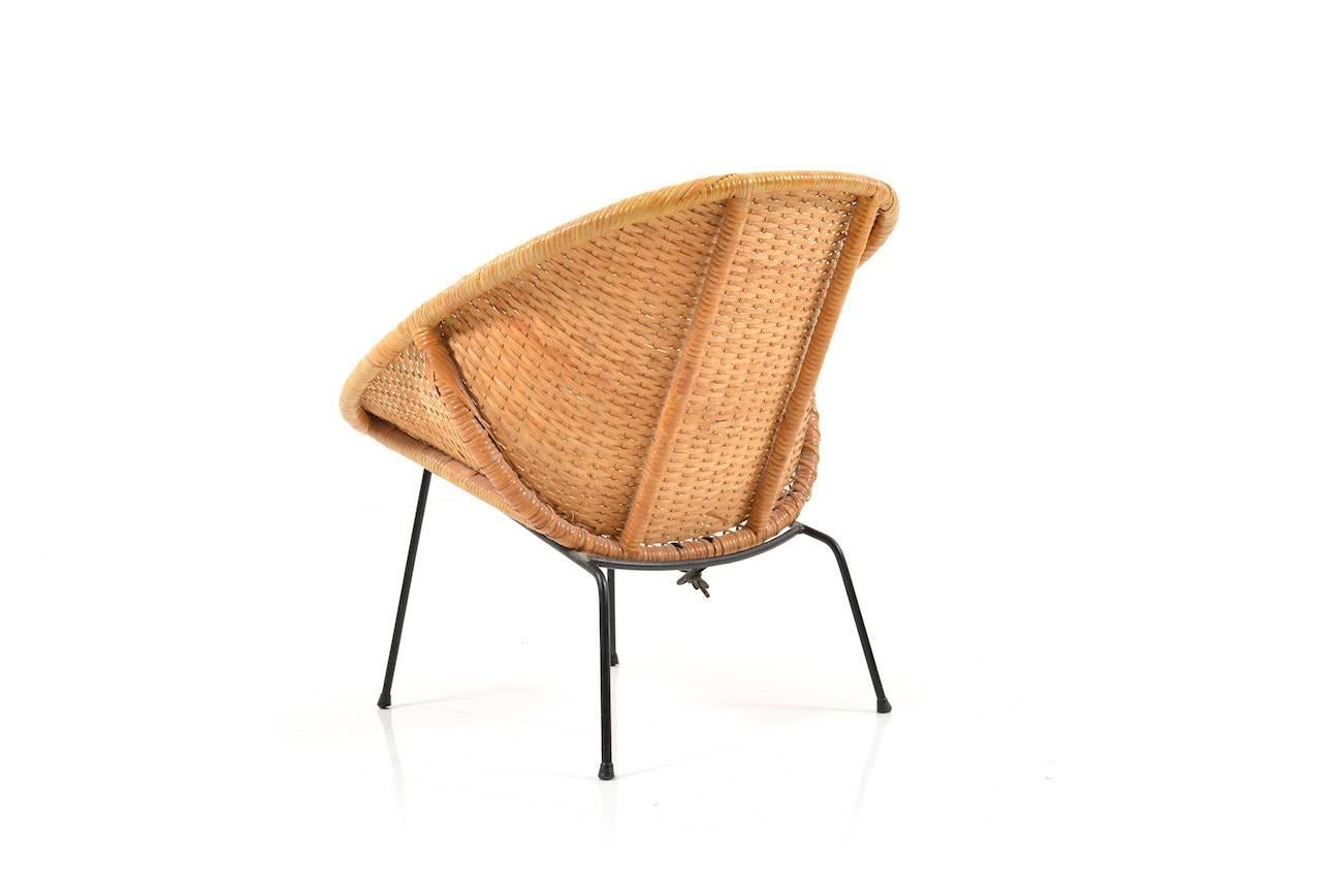 Early Danish basket-chair. Black lacquered metal frame, Denmark, 1940s. In good vintage condition.