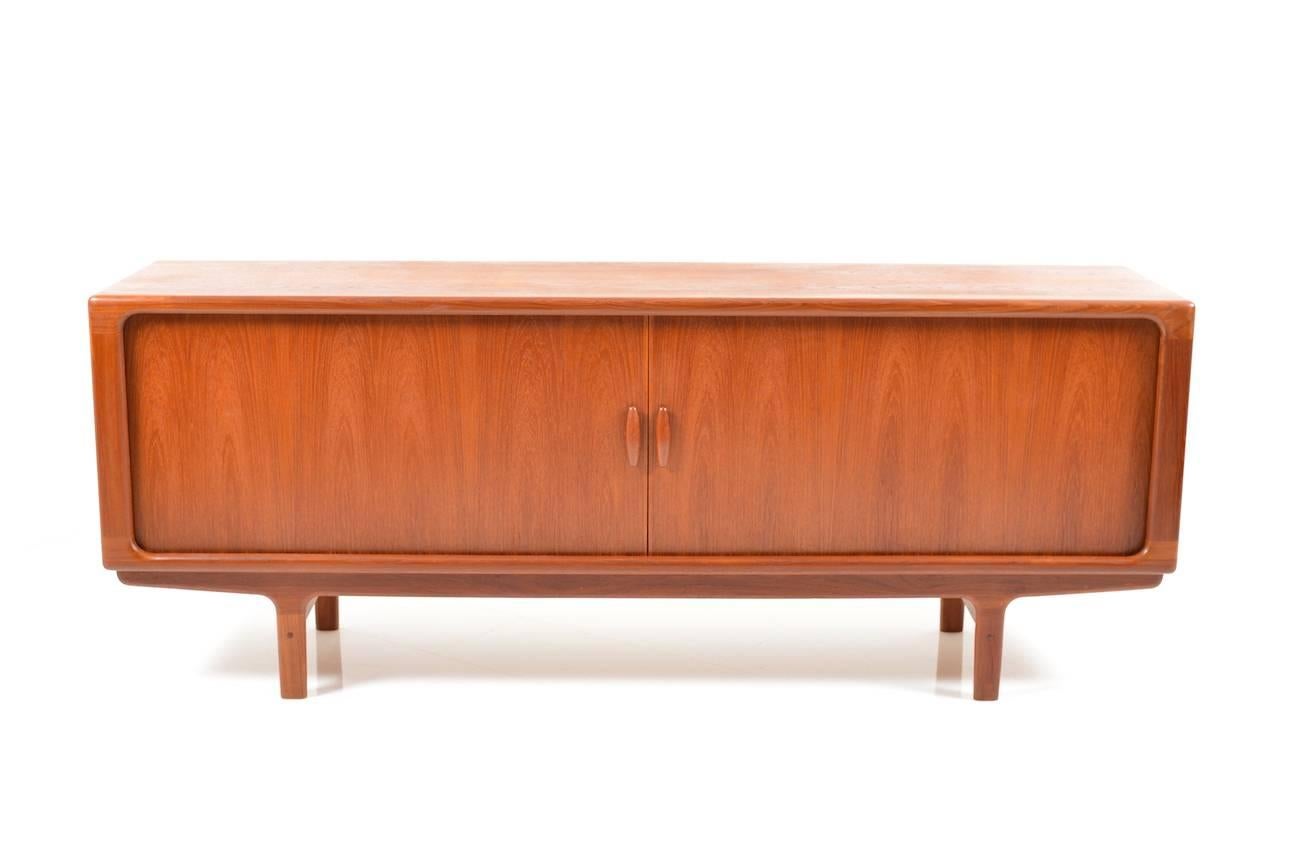 Danish modern teak wooden sideboard by Dyrlund. Two Jalousie doors and inside with three drawers. Made in Denmark early 1960s by Dyrlund. In very good vintage condition, ready to stand.