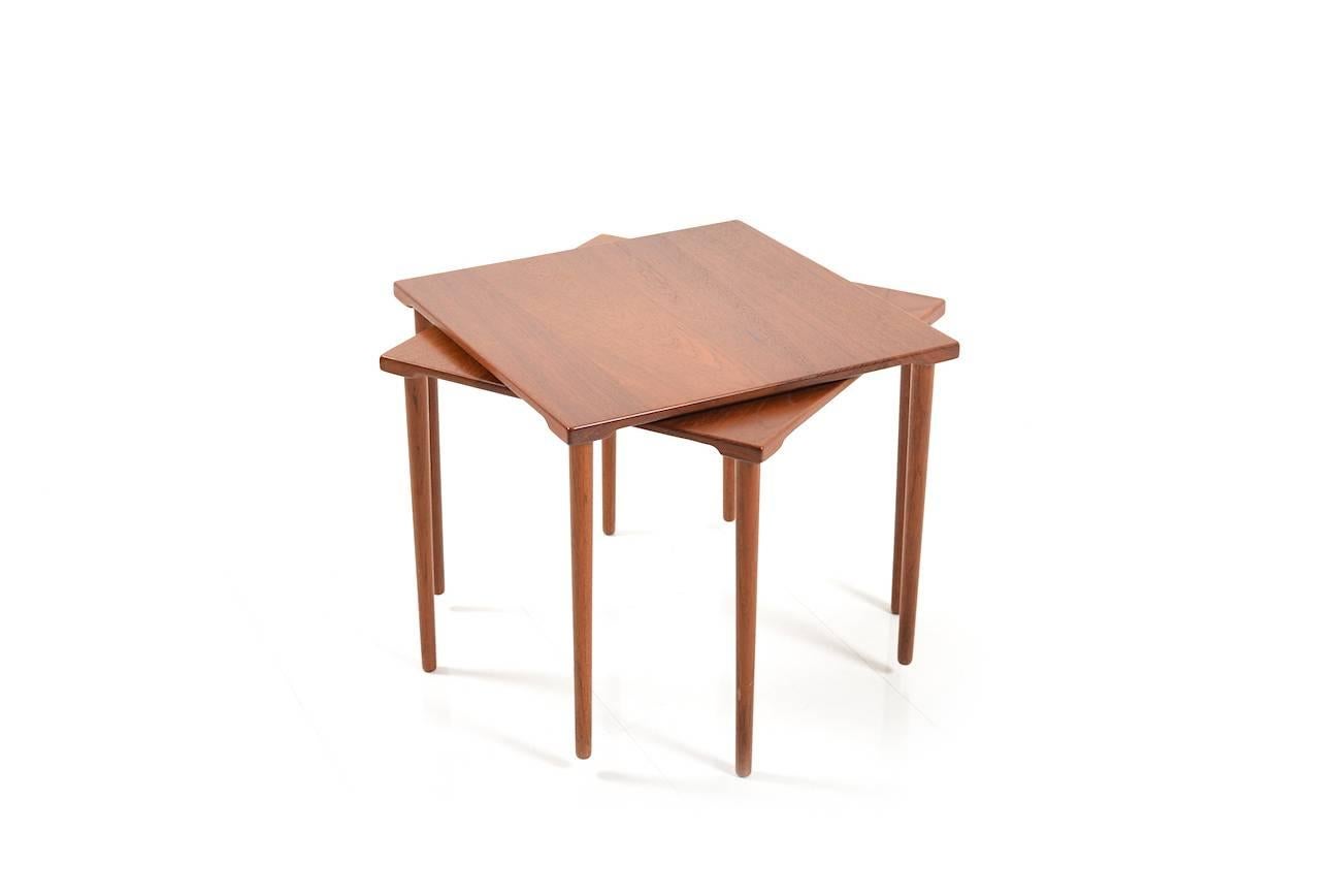 Very nice teak wooden side tables by France & Son, 1960s. Square tabletop on round legs. Very good vintage condition.