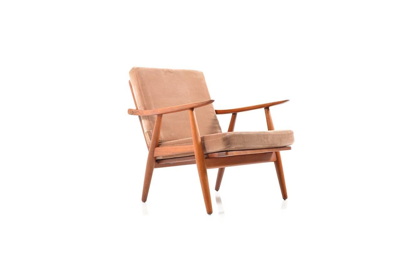 Early GE-270 teak wooden easy chairs by Hans J. Wegner. Designed in 1950s. Manufactured by GETAMA. Cushions in foam material with mud-colored mohair wool. Early production. Great Danish design by the icon Hans Wegner.