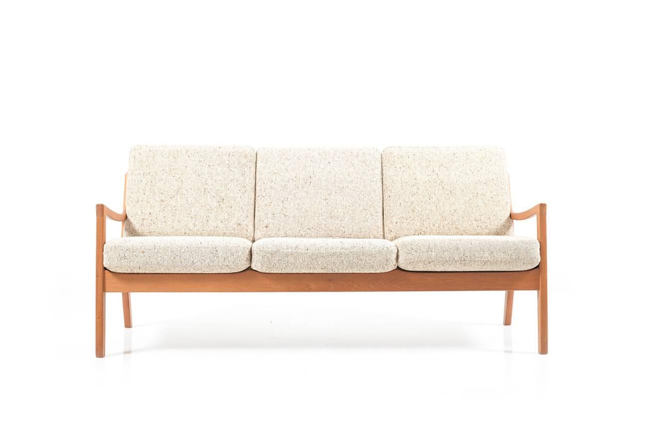Midcentury teak wooden three-seat sofa by Ole Wanscher. Senator Series. Manufactured by CADO / France & Son 1960s. Original cushions in beige/brown mixed wool fabric. Very good vintage condition.