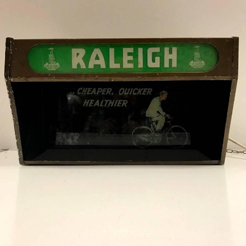 Extremely rare Raleigh cycles advertising light box dating from the late 1930s-early 1940s. Presenting the Raleigh cycle as 'Cheaper, Quicker, Healthier'. Metal casing, with all original glass and mirrors to project the image when lit. There are