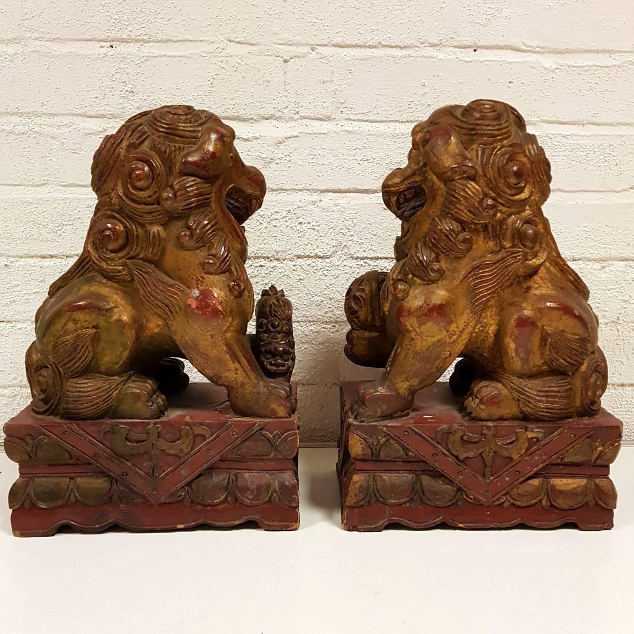 Hand-Carved Pair of 19th Century Carved Wood Lacquered and Gilt Chinese Foo Dog Figures For Sale