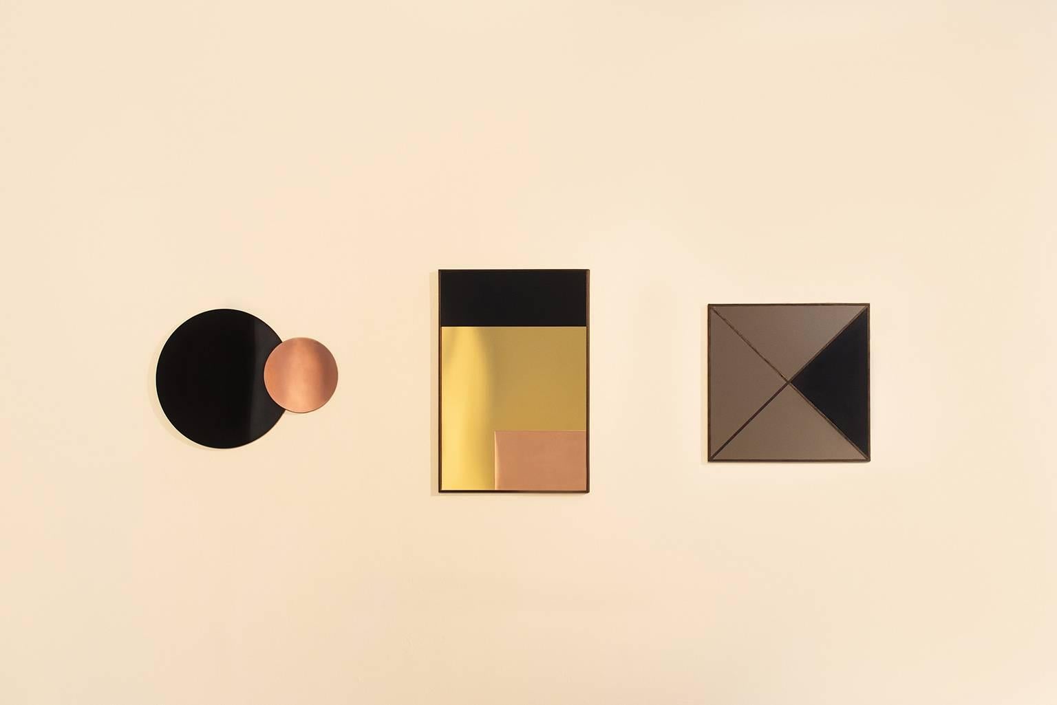The geometric design of the mirrors reference constructivist painting. Form is
created by matching various shapes in contrasting geometric proportions. My
mirrors display a rich harmony and simplicity of materiality. The frame is in ebonized oak,