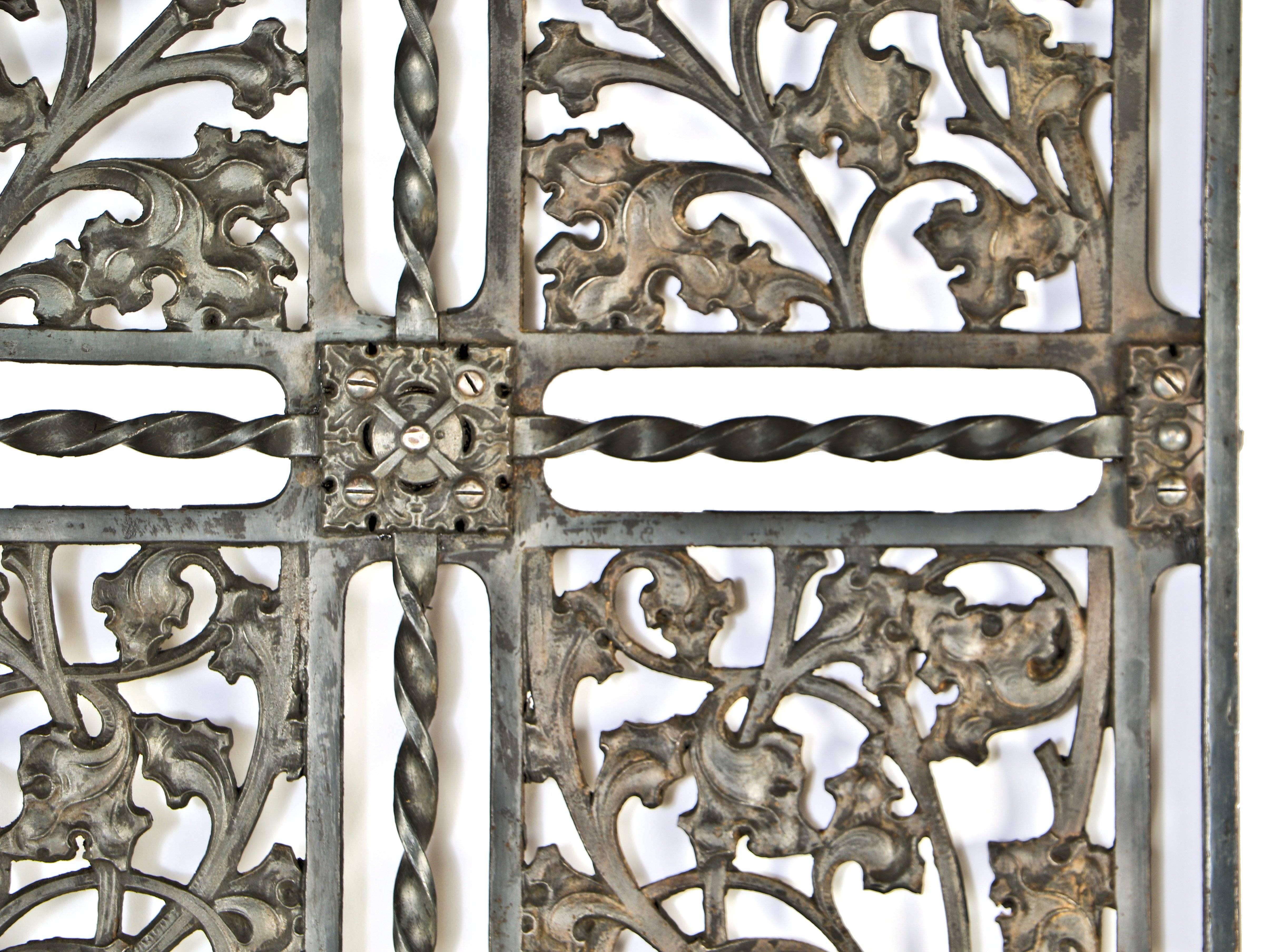 original circa 1896 striking Gothic style ornamental cast iron interior elevator door, removed from the historic fisher building lobby during renovations and/or upgrades. the elevator door has six deep relief panels featuring a remarkably