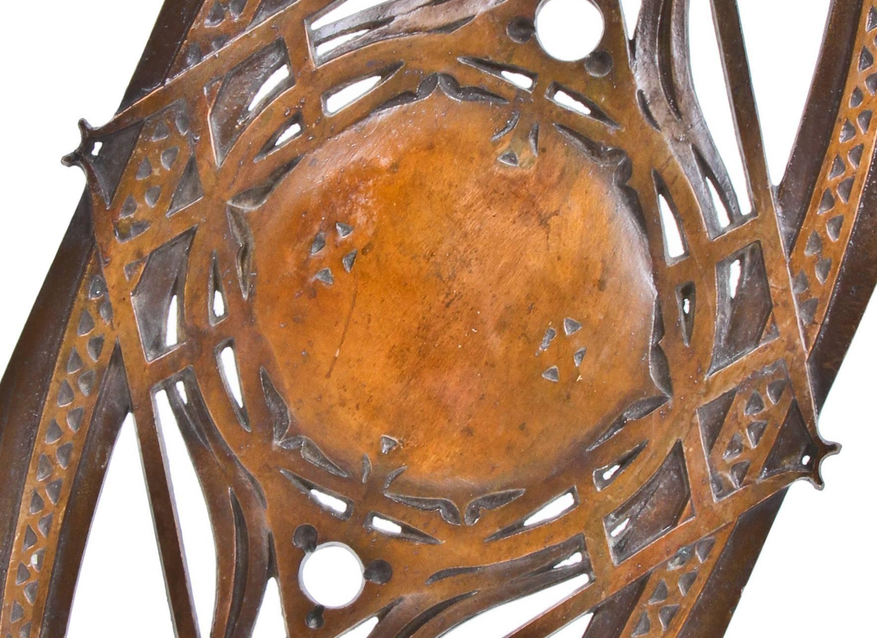 Original 19th century historically important single ornamental cast iron interior staircase baluster salvaged from the Chicago stock exchange prior to demolition in 1972. The copper-plated panel features a strongly geometric, reticulated oval design