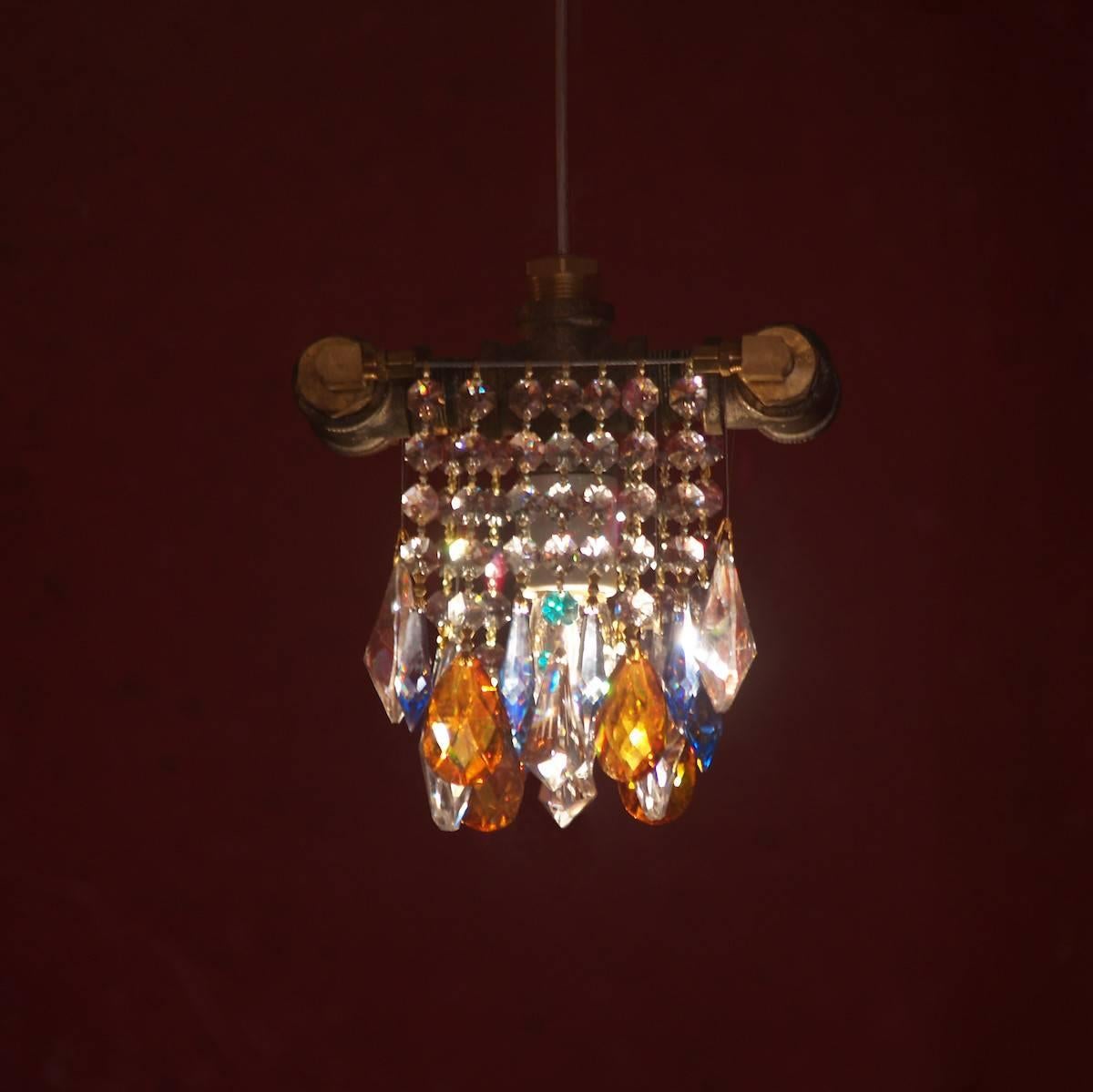 The single-bulb chandelier incorporates all the modern lighting design elements and delicious Industrial chic contrasts of McHale Chandeliers into a single jewel of a chandelier. Perfect for small applications, or anywhere that needs a touch of