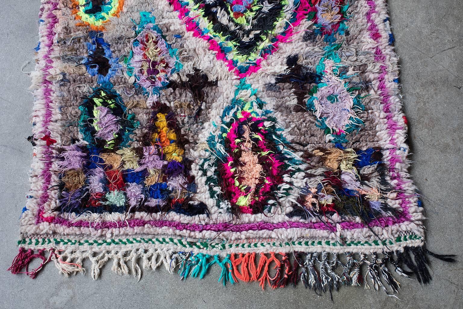 This stunning artistic piece is made by the Azilal tribe in the high Atlas Mountains of Morocco. This pile rug is mixed with warm shaggy wool and cotton fibers.

Measurement does not include fringe.
