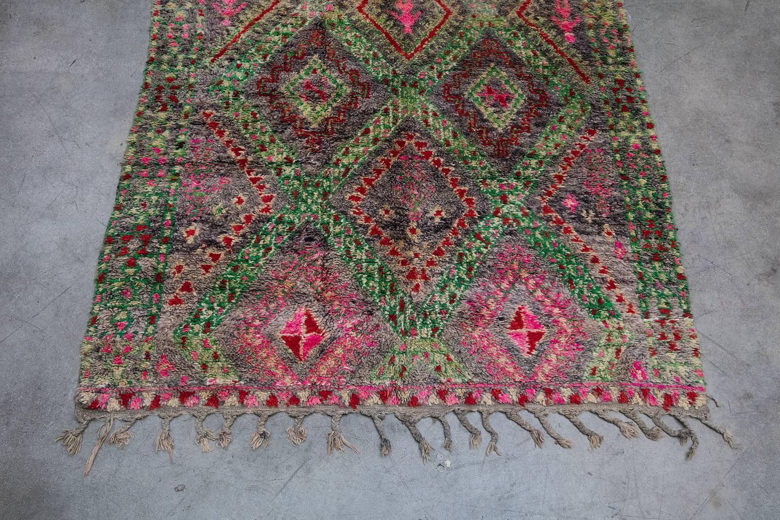 Ait Seghrouchène, dated to circa 1980. tribe yields from the Middle Atlas region of Morocco. Their rugs tend to be very plush, woven to provide warmth and comfort during the winter months.  Ait Seghrouchène rugs feature a well-known composition of