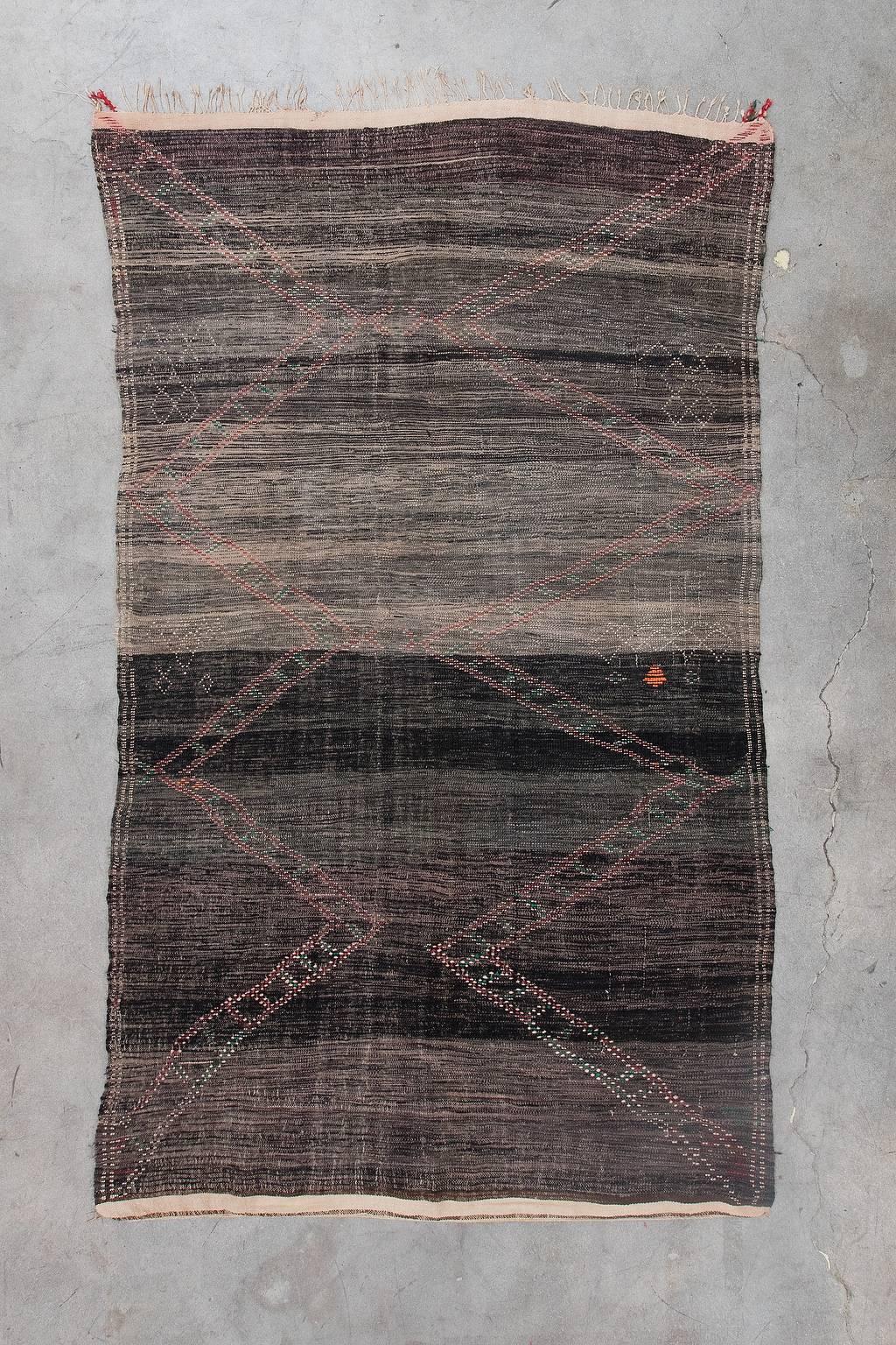 The Beni M'Rirt tribe yields from the Middle Atlas region of Morocco. Their rugs tend to be very plush, woven to provide warmth and comfort during the winter months. Beni M'Rirt rugs are well-known for their darker bold color combinations. You can