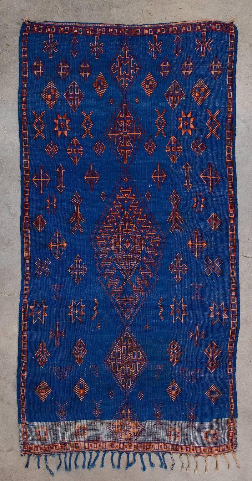 The Beni M'Guild tribe yields from the Middle Atlas region of Morocco. Their rugs tend to be very plush, woven to provide warmth and comfort during the winter months. Beni M'Guild rugs feature a well-known composition of diamonds in the