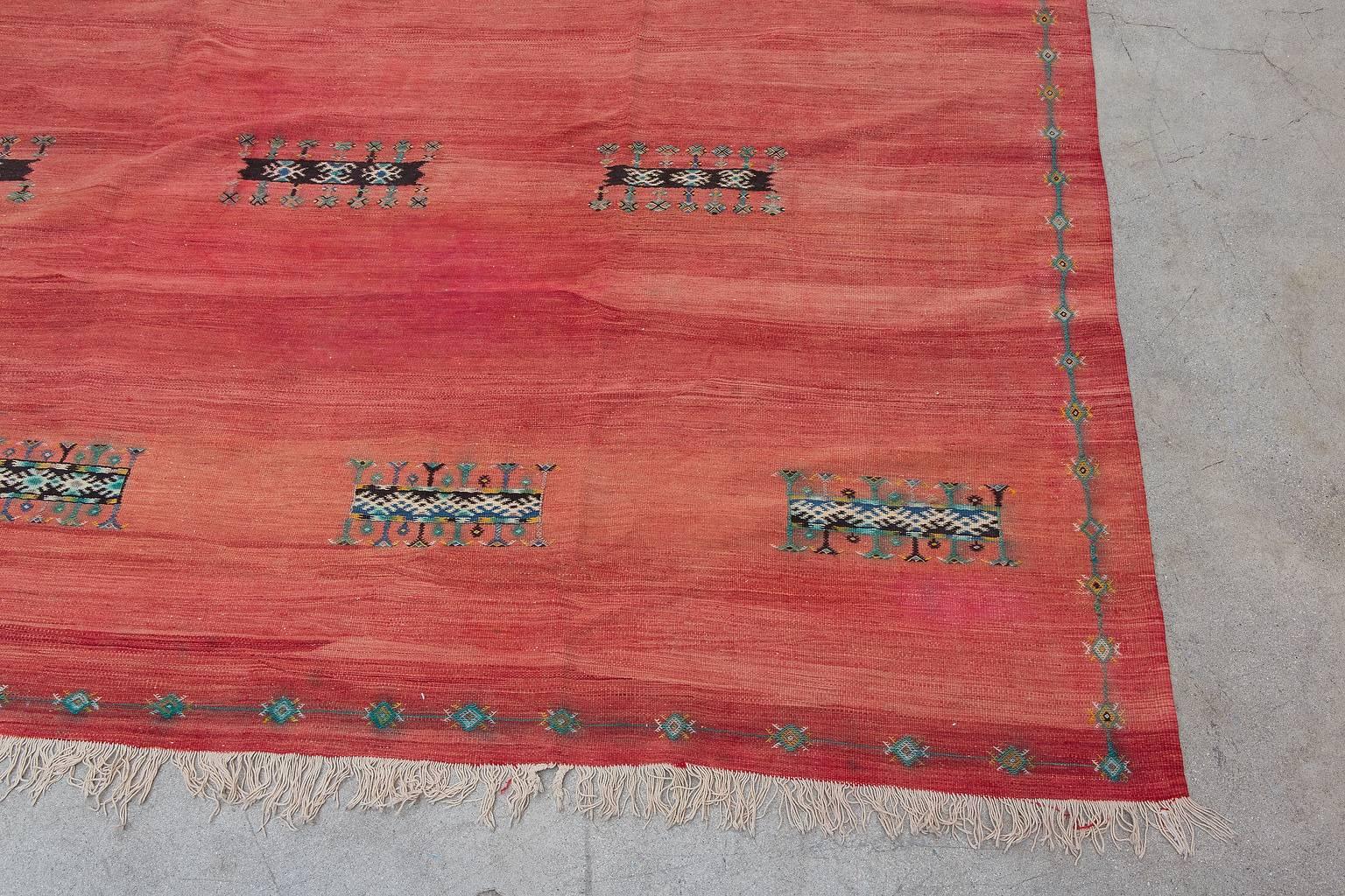 Ait Ouaouzguite tribe who reside in the Siroua Mountains in Southern High Atlas Morocco. Plain-woven fabrics with additional tapestry-weave designs are known in the region inhabited by the Ait Ouaouzguite tribe. This flat-weave is no exception with