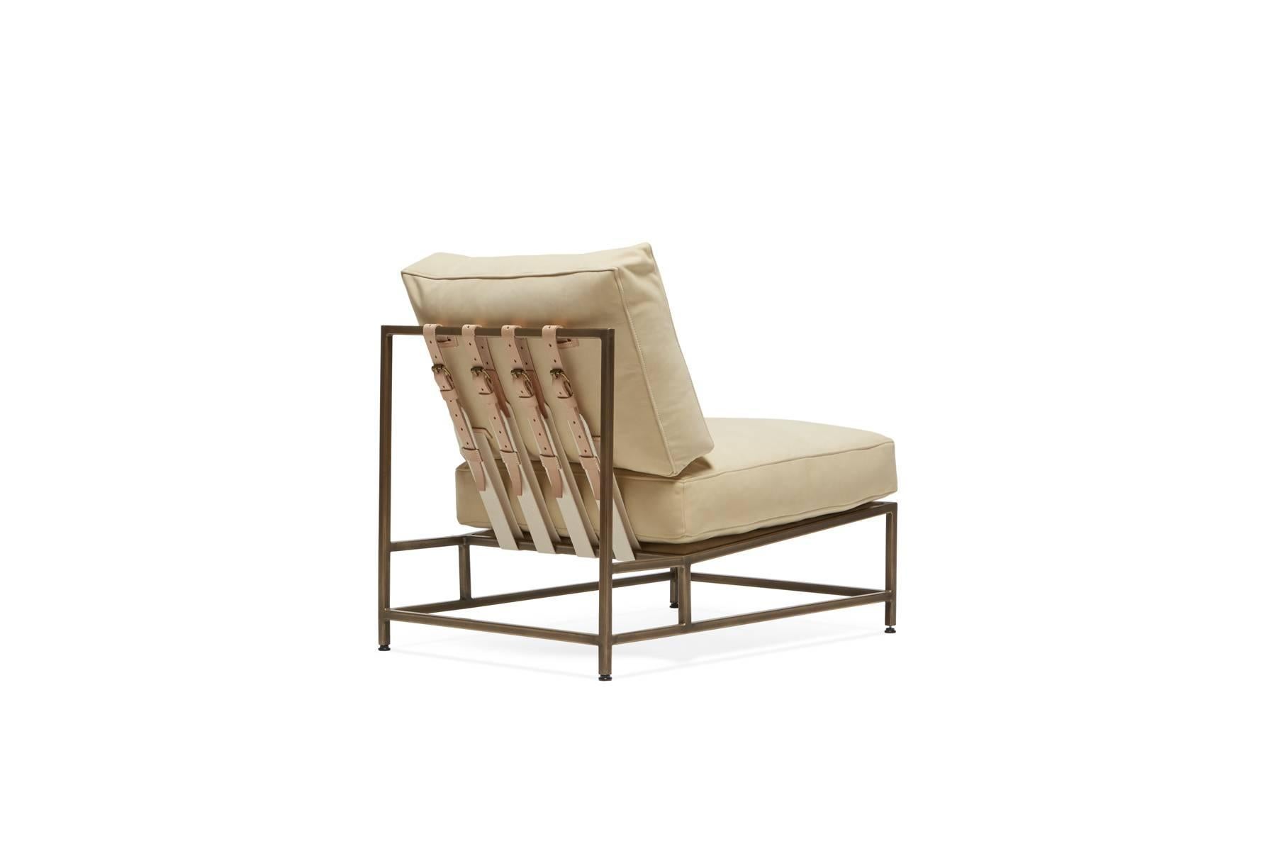 Sleek and refined, the Inheritance Chair is a great addition to nearly any space. 

This variation is upholstered in a warm cream nubuck leather with a soft suede like touch. The foam seat cushions have been wrapped in down, allowing for a soft and
