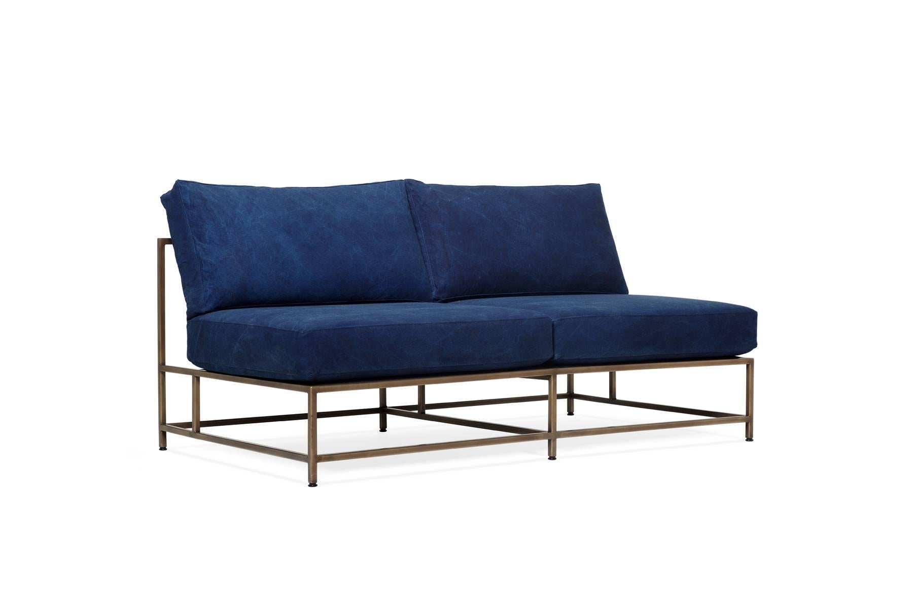 The Inheritance Loveseat by Stephen Kenn is as comfortable as it is unique. The design features an exposed construction composed of three elements - a steel frame, plush upholstery, and supportive belts. The deep seating area is perfect for a