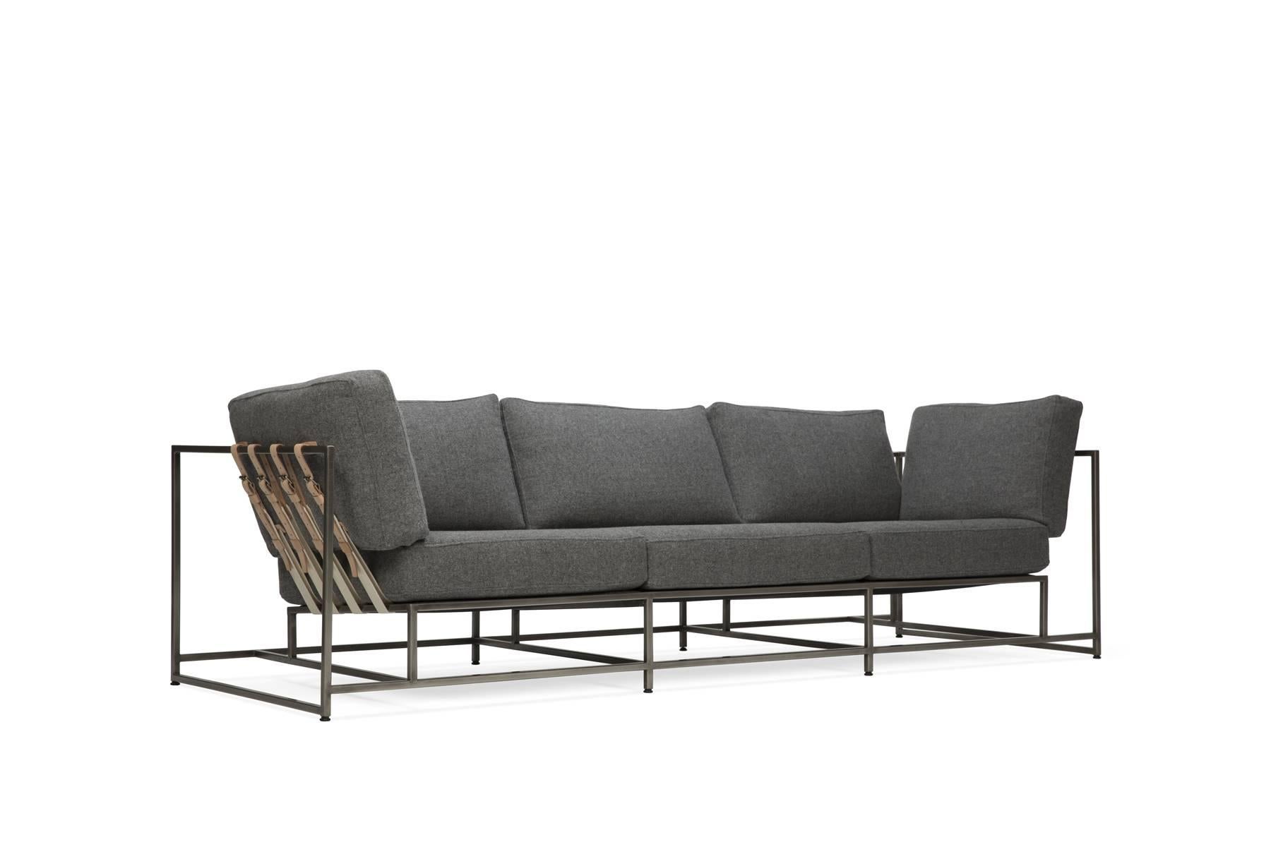 The Inheritance Sofa by Stephen Kenn is as comfortable as it is unique. The design features an exposed construction composed of three elements - a steel frame, plush upholstery, and supportive belts. The deep seating area is perfect for a relaxing