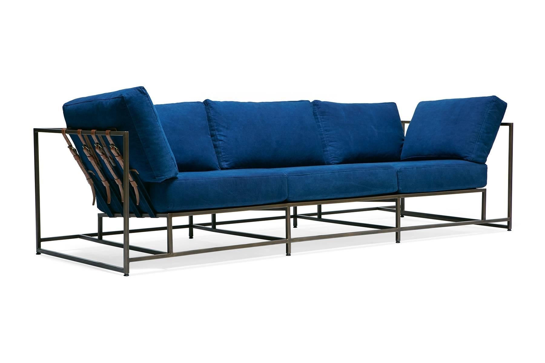 The Inheritance Sofa by Stephen Kenn is as comfortable as it is unique. The design features an exposed construction composed of three elements - a steel frame, plush upholstery, and supportive belts. The deep seating area is perfect for a relaxing