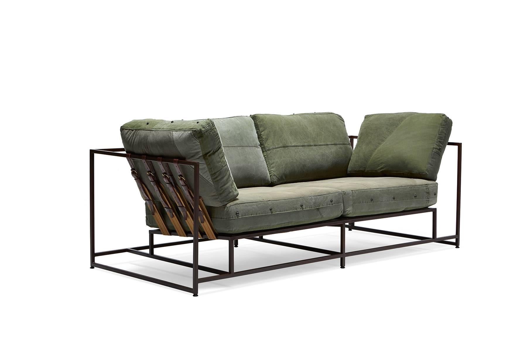 
The Inheritance Two Seat Sofa by Stephen Kenn is as comfortable as it is unique. The design features an exposed construction composed of three elements - a steel frame, plush upholstery, and supportive belts. The deep seating area is perfect for a