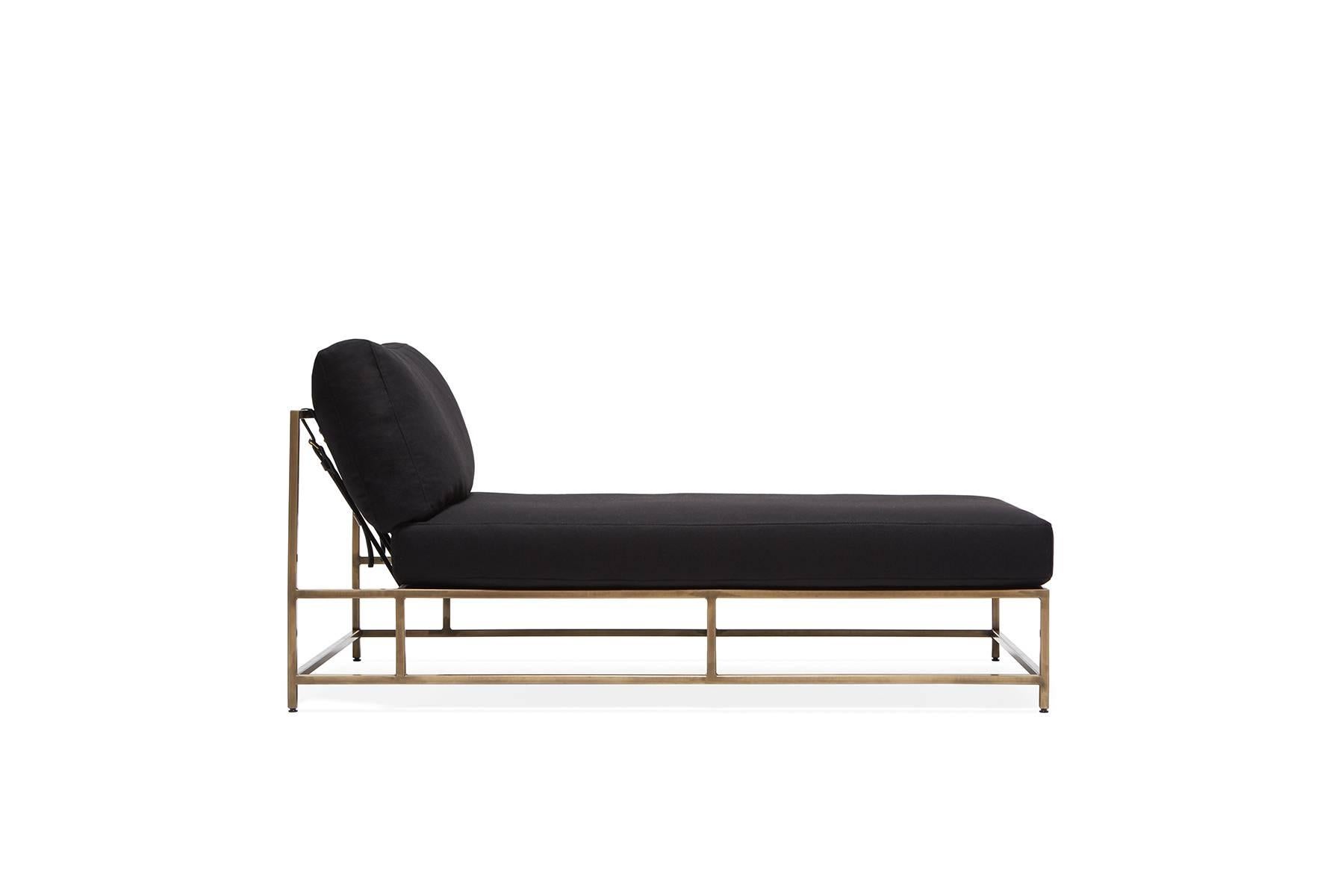 The Inheritance Chaise Lounge by Stephen Kenn is as comfortable as it is unique. The design features an exposed construction composed of three elements - a steel frame, plush upholstery, and supportive belts. The deep seating area is perfect for a